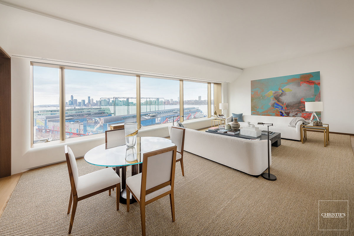 551 W 21ST ST 9B New York, New York Expertly designed by Foster + Partners, Residence 9B is a nearly 4,000 square foot, three-bedroom, three-and-a-half-bathroom home with breathtaking panoramic city and water views to the south, north and east.
With direct elevator access through a private vestibule, this stately, column-free home offers a magnificent center galley and a south-facing 30'x19' grand room with adjacent library. The top-of-the-line kitchen features custom oak cabinetry by Molteni and C | Dada, Dornbracht fixtures, beveled Blanco de Macael marble countertops and backsplash, as well as a full suite of exceptional appliances including: fully integrated Sub-Zero refrigerator and freezer, two Miele convection ovens, a five-burner Gaggenau cooktop, two Miele dishwashers and a Fisher & Paykel cooling drawer. Additionally, there are two warming drawers, as well as a Miele microwave and espresso system tucked away in the custom pantry. Adjacent to the kitchen is a large formal dining room.
In the private quarters, a stunning corner master bedroom suite features a large walk-in closet with extensive custom millwork by Foster + Partners, a luxurious master bathroom oasis with double door entry, a meditative freestanding tub facing south, radiant heated Luna Black granite floors, a custom Corian vanity with integrated lighting, Quarella stone tiles and elegant Dornbracht fixtures. It also includes a separate enclosed shower and water closet with custom designed floor-to-ceiling translucent glass doors. Completing the home are two additional bedrooms with en-suite bathrooms and a powder room, all with Travertino Striato stone floors and Dornbracht fixtures.
With rich materials throughout, Residence 9B offers details that are akin to a more elegant era, reinterpreted through the architect's modernist sensibility: 11-foot ceilings, 9-foot doorways, French-inspired oak herringbone floors, and luminous metal surrounds with a deep façade for perimeter seating in each panoramic window. This residence is fully integrated with pre-wiring for the most advanced home technology systems, includes motarized blinds, has a separate service entrance, and a laundry room. This offering includes a dedicated parking space in the building with a monthly fee of $650. Tenant In Place Until May 9th. 24-Hour Notice To Show. Building Description: On a premier West Chelsea art block, with world-class gallerists Paula Cooper, Barbara Gladstone, Larry Gagosian and David Zwirner as neighbors, and flanked between the nightlife, restaurant and shopping destination of the Meatpacking District, the countless restaurants, hotels, businesses and amenities at the newly opened Hudson Yards, and the bucolic environs of the nearby High Line and Hudson River Parks, 551 West 21st Street is at the center of it all. Exquisitely crafted by the master architects of Foster + Partners, 551 West 21st Street features a private, gated drive court surrounded by a 20-foot green wall and a dramatic, awe-inspiring 34-foot, double height lobby with grand chandelier. Additional amenities include full-time doorman and a concierge, porter and valet services, a custom designed fitness center with a his and her spa, yoga room, residents' lounge, children's playroom, bike storage, a live-in super and a dedicated, separate service entry. Parking is available for lease or purchase.