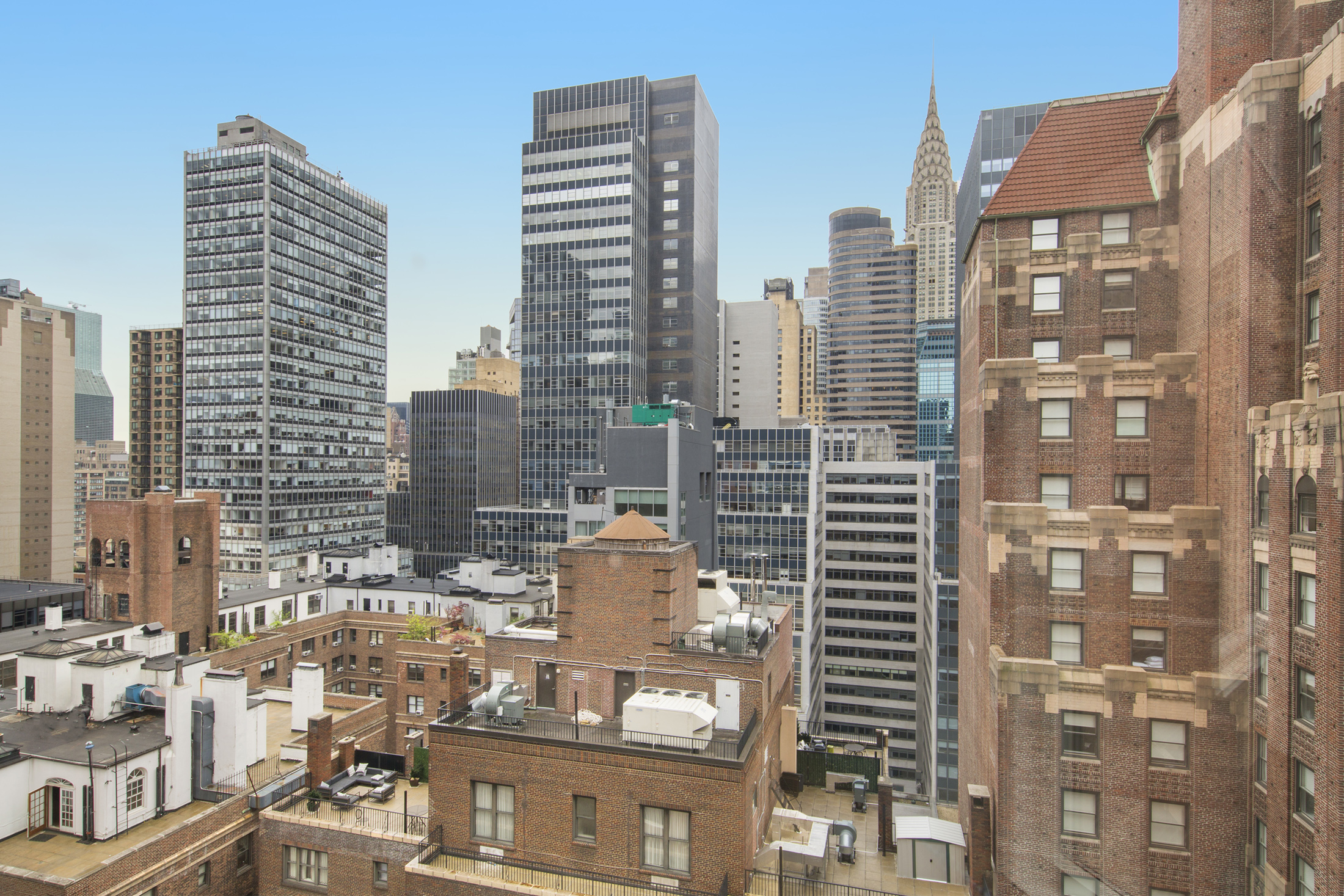 145 E 48TH ST 23BC New York, New York This gut-renovated, high floor apartment is the seamless combination of two one-bedroom apartments, making it one of the largest units in the building at 1462 square feet. With exposure north, south, and west there is excellent light throughout the day and wonderful city/skyline views. The split bedroom layout includes an expansive living/dining room and two very large and private bedrooms, each with their own newly updated, marble bathroom plus a well-located guest bath. The Master "Suite" includes a large double-sink bathroom as well as a small home office with a sizable closet for extra storage. The Cosmopolitan is a pet-friendly, full-service condominium with a doorman and concierge, live-in Super, garage and central laundry room in a convenient midtown location; close to Grand Central Station, the U.N., great shopping, restaurants, and hotels. Current monthly assessment of $227.31. MORE PHOTOS COMING SOON!