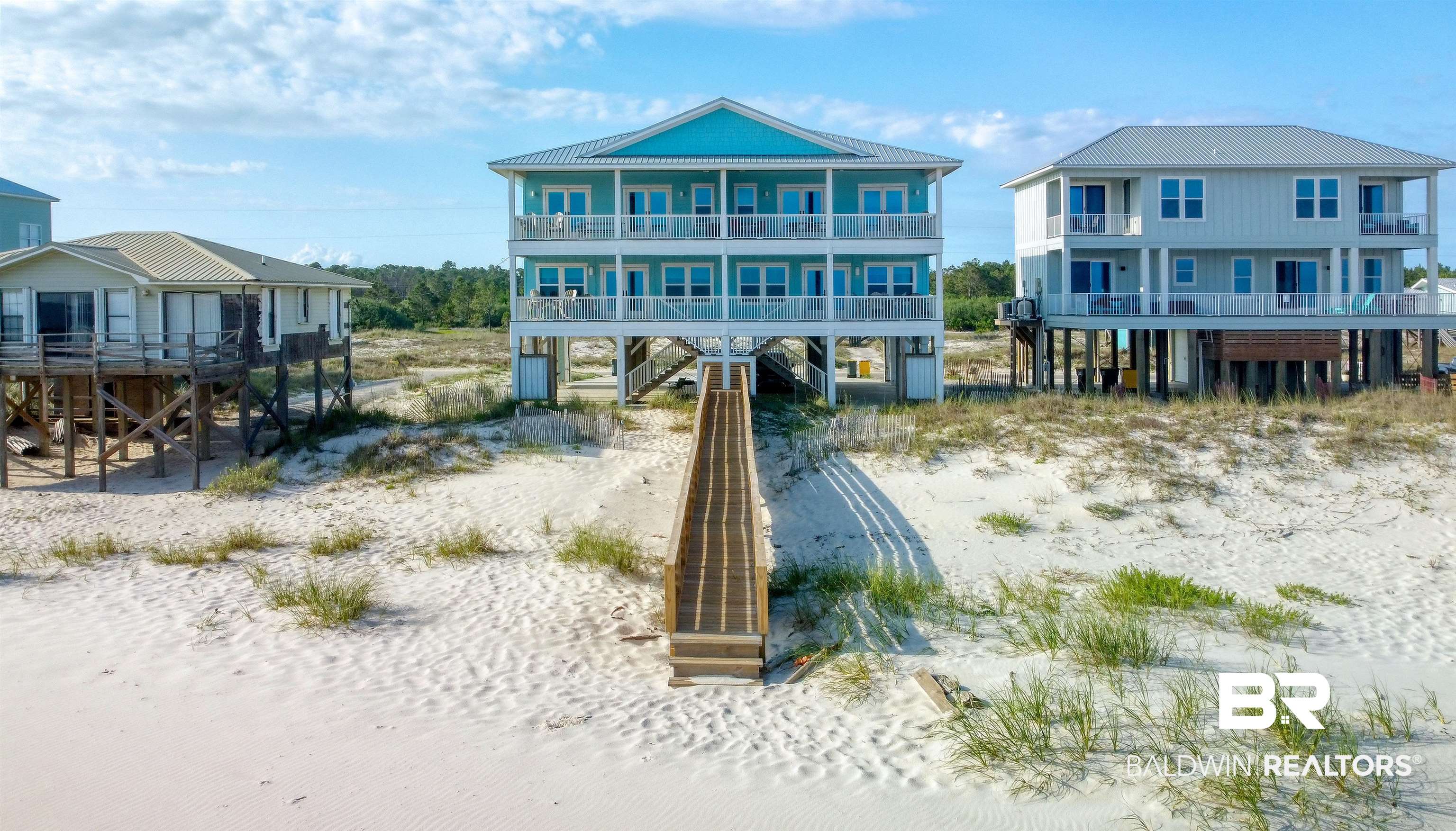 Stunning beachfront duplex in Ft. Morgan area: 10 bedrooms / 10 bathrooms (5BR/5BA per side) with a private connecting door—ideal for large groups, or investment. Enjoy direct beach access, relax on the porch with endless Gulf views, crashing waves, wildlife, and spectacular sunsets. Kids play in the sand while you swim in emerald waters or simply soak up the Alabama sunshine. Fresh, like-new condition—perfect family retreat or high-potential rental property. Make memories steps from the surf! 5318 & 5320 Beach Blvd.  Buyer to verify all information during due diligence.