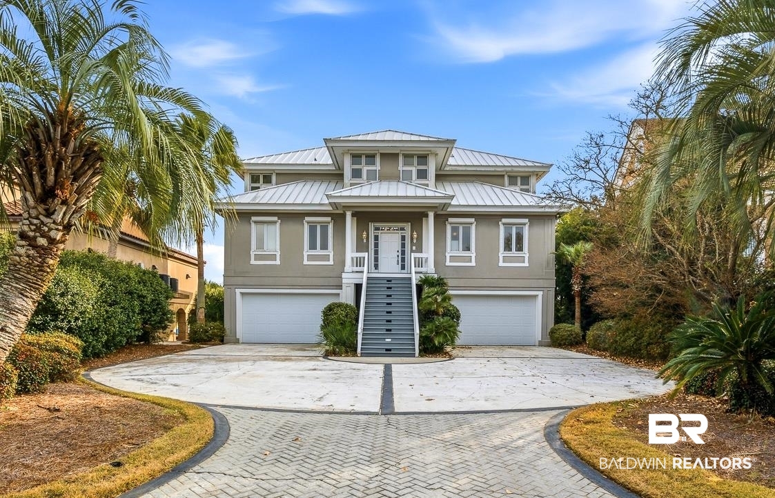 Welcome to beautiful & prestigious Ono Island!  This beautiful home rests directly on Ole River with magnificent and unobstructed Gulf Views.  The spacious and expansive back porch provides for excellent views of the river and gulf.  This home is incredibly close to the main gated entry of Ono Island offering all of the security and amenities the island has to offer without excessive travel to your home.  Ideal location!!  The Ono bridge is just an eyeshot southeast.  A boater's dream giving easy access to Ole River, the Gulf of Mexico and Cotton Bayou.  Easy access out to the intracoastal canal.  So many fun spots to shop, dine, and catch excellent music all by boat!  The interior of the home boasts amazing natural light in each room.  The spacious primary living space provides area for an informal & formal living room areas both with built in shelving.  The home has a formal dining room off the kitchen with built in cabinets for entertaining guests or evening family meals.  The kitchen has all stainless appliances.  There is a breakfast bar in the kitchen for those quick meals on the go!  Spacious kitchen perfect for the buyer with gourmet cuisine in mind.  Two bedrooms and two full bathrooms upstairs.  Downstairs you will find two double garages with plenty of storage space.  In addition there is a downstairs recreation room and full bedroom with a shared full bathroom!  There is an exterior built in storage room on the west side of the home for beach toys and patio furniture. The home is protected by a full set of installed rolling storm shutters.  The home is protected by a current termite bond.  Available community amenities including a huge pool, fitness center, and a hot tub.  Boat launch, tennis/pickleball, playground, and green space access included in HOA dues.  If you love the Ole River location this home is a must see! Exceptionally well built home! Buyer to verify all information during due diligence.