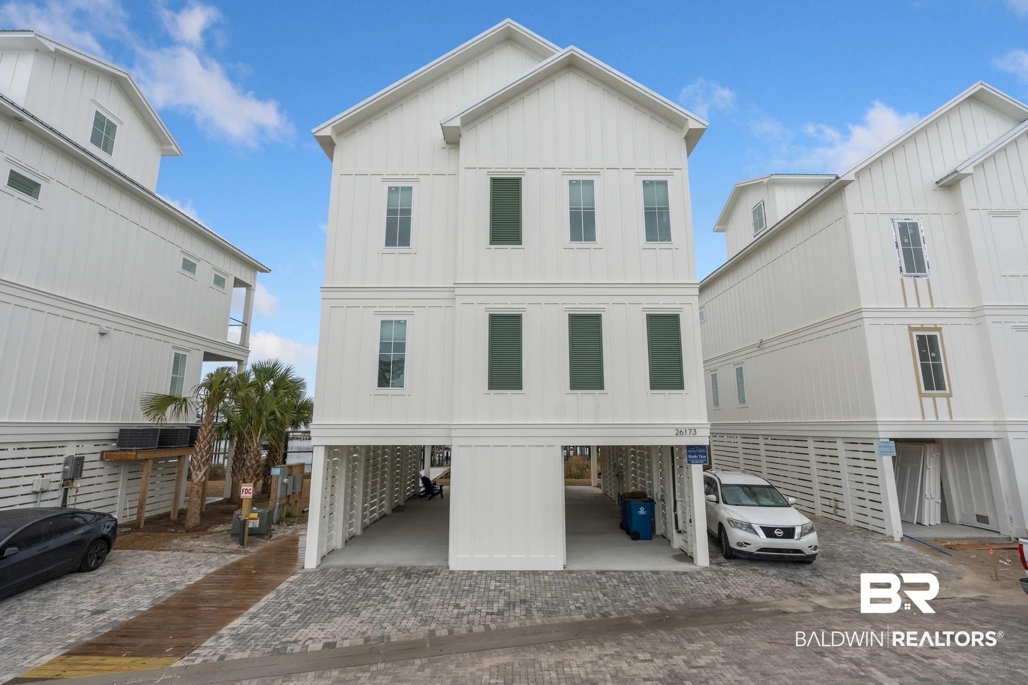 This beautiful 3 story property features 5 spacious bedrooms, 5 and a half bathrooms, and ample living space for up to 16 guests. The home is tastefully decorated and fully equipped with all the modern amenities, including a kitchen equipped with top-of-the-line Monogram appliances, quartz countertops, custom cabinetry, and an elevator that provides easy access to all levels of the home. Residents and guests will enjoy a large zero-entry pool with sun shelves, brick-paved streets, and a marina with a sun deck. The home is located just minutes from the beach, and is steps away to Ole River where you will find an assigned boat slip #1 to use during your stay. Buyer to verify all information during due diligence.
