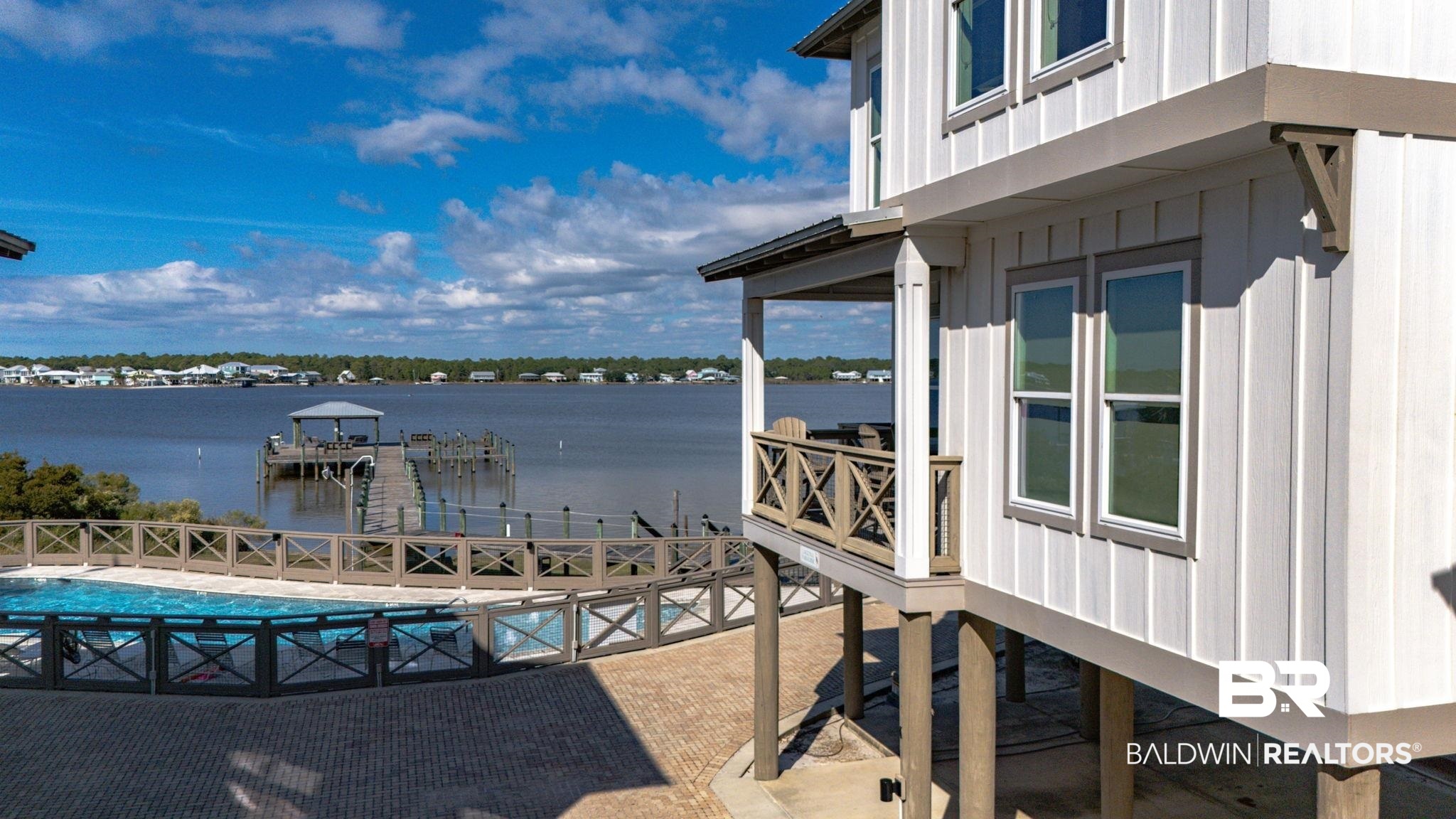 Welcome to Laguna Paradise on Little Lagoon! The sellers are offering a $15,000 seller concession with an accepted offer. Nestled in the Cottages at Lagoon Pass community on West Beach Boulevard, this stunning 2-bedroom, 2.5-bath home sits directly on the lagoon, offering serene water views and the best of coastal living. Inside, you’ll find modern coastal design with an open-concept layout, elegant furnishings, and abundant natural light. The spacious living area flows seamlessly to a private balcony where you can relax and take in the ever-changing colors of the lagoon. Enjoy the prime lagoon-front location with access to on-site boat facilities, fishing pier, and a community pool. When you’re ready for the beach, the Gulf is right across the street. Located just minutes from Gulf Shores’ top restaurants, shopping, and attractions, this property is perfect as a primary residence, vacation retreat, or investment opportunity. Experience the ultimate combination of luxury, location, and lifestyle in this exceptional lagoon-front cottage. Buyer to verify all information during due diligence.