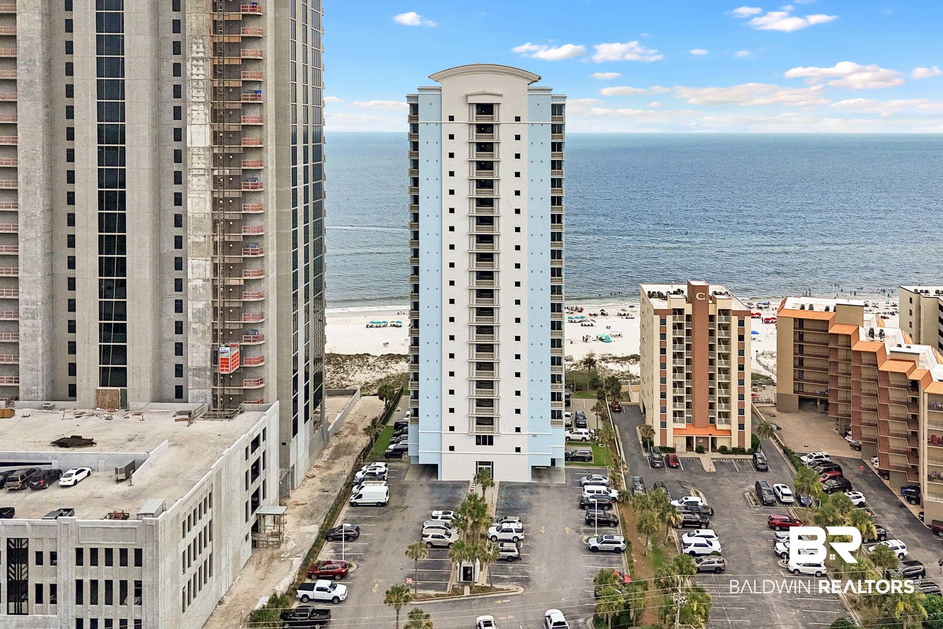 Seller to provide a $5,000 decorating/paint credit at closing to personalize the interior! This 15th-floor 4-bedroom, 4-bath Gulf-front corner condo at The Colonnades is a true rental powerhouse and luxury retreat in one. Positioned high above the shoreline for maximum demand, this unit delivers premium elevation, breathtaking panoramic Gulf views, and strong income potential. With over 2,100+ sq. ft. of spacious living, floor-to-ceiling windows flood the open-concept living and dining areas with natural light while showcasing unobstructed Gulf views. The fully equipped kitchen features granite countertops, stainless appliances, and ample seating for large groups. The Gulf-front primary suite offers direct balcony access, a king bed, and a spa-style en-suite bath with dual vanities, jetted tub, and walk-in shower. A second king suite with bay-view balcony access, a queen guest suite. Additional highlights include a walk-in laundry room with full-size washer and dryer, and premium finishes. Building amenities include an outdoor pool, hot tub, and fitness center. Prime Gulf Shores location just minutes from dining, shopping, and entertainment. Whether you’re seeking a turnkey income property or a luxury second home that pays for itself, this 15th-floor Gulf-front corner unit at The Colonnades delivers outstanding value. Buyers and agents to verify all information during due diligence.