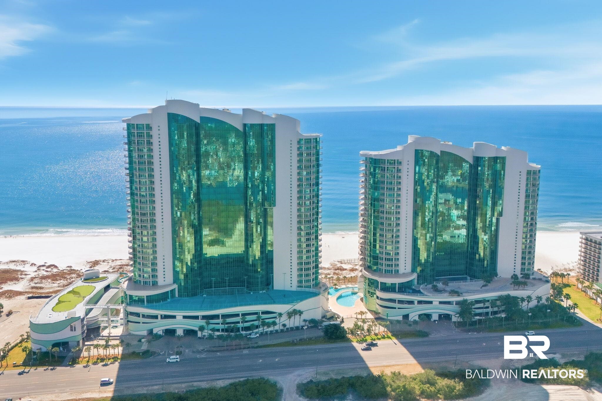 RARE EAST CORNER UNIT | TURQUOISE PLACE — ORANGE BEACHOVER $58,000+ IN RENTAL INCOME ON THE BOOKS | APPROACHING $100,000 ANNUAL PERFORMANCEStunning East corner residence with expansive floor-to-ceiling windows on the East and South sides flood the space with natural light and showcase breathtaking panoramic views of the Gulf of Mexico.Offering unmatched value, this exceptional 4-bedroom, 4.5-bath luxury condominium delivers strong, immediate income potential with over $58,000 already secured for 2026 and rental performance approaching $100,000 annually This spacious residence features a thoughtfully designed open-concept floor plan for entertaining, complemented by custom furnishings, and electric curtains in the main living area, dining space, and two bedrooms.The gourmet kitchen is a chef’s dream, complete with:Granite countertopsStylish tile backsplashStainless steel appliances including Sub-Zero and WolfGenerous prep and entertaining spaceStep onto the oversized balcony to experience true resort living with a private hot tub, Blaze Marine grill, and new outdoor furnitureAdditional highlights include a large smart TV in the living room plus TVs in all  rooms, delivering a fully turnkey luxury ownership experience.Turquoise Place amenities are second to none:Indoor and outdoor poolsTwo beachfront poolsLazy river and hot tubsFitness center, steam and sauna roomsTennis courts300-foot waterslide and splash padPutting green and playgroundOutdoor movie spacePoolside bar and grillEV charging stations24-hour securityDirect beach accessAssigned covered parking included.Rare East corner opportunity with proven income, immediate cash flow, and premier positioning in one of Orange Beach’s most prestigious luxury resorts.Buyer to verify all information during due diligence.  Buyer to verify all information during due diligence.