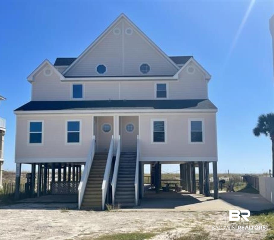 FULLY FURNISHED, RENT READY, GULF FRONT 1/2 duplex with 36 feet of PRIVATE BEACH and 2026 RENTALS ON THE BOOKS! Enjoy full autonomy with NO HOA! Recent Updates include 2024 Hot water heaters, 2023 A/C units, 2025 remodeled bathrooms, 2022 Remodeled kitchen, new windows in 2019. WALKING DISTANCE to multiple restaurants, 2,560 sq ft and water views from every room! 3 spacious bedrooms, PLUS Hall Bunks make it an excellent vacation rental with beds for 12 guests! Featuring an OPEN FLOORPLAN with full southern Gulf views and two Gulf facing balconies, a WELL DESIGNED ISLAND KITCHEN, wet bar w/mini-fridge. Ground level offers a storage room and plenty of parking space for multiple vehicles, and an entertainment area complete with a built in BBQ grill, prep table, picnic table and paved area that offers plenty of space for dining and gaming.  All measurements are approximate.  Buyer or Buyers agent to verify all information to buyer's satisfaction. Being sold FULLY FURNISHED. Buyer to verify all information during due diligence.