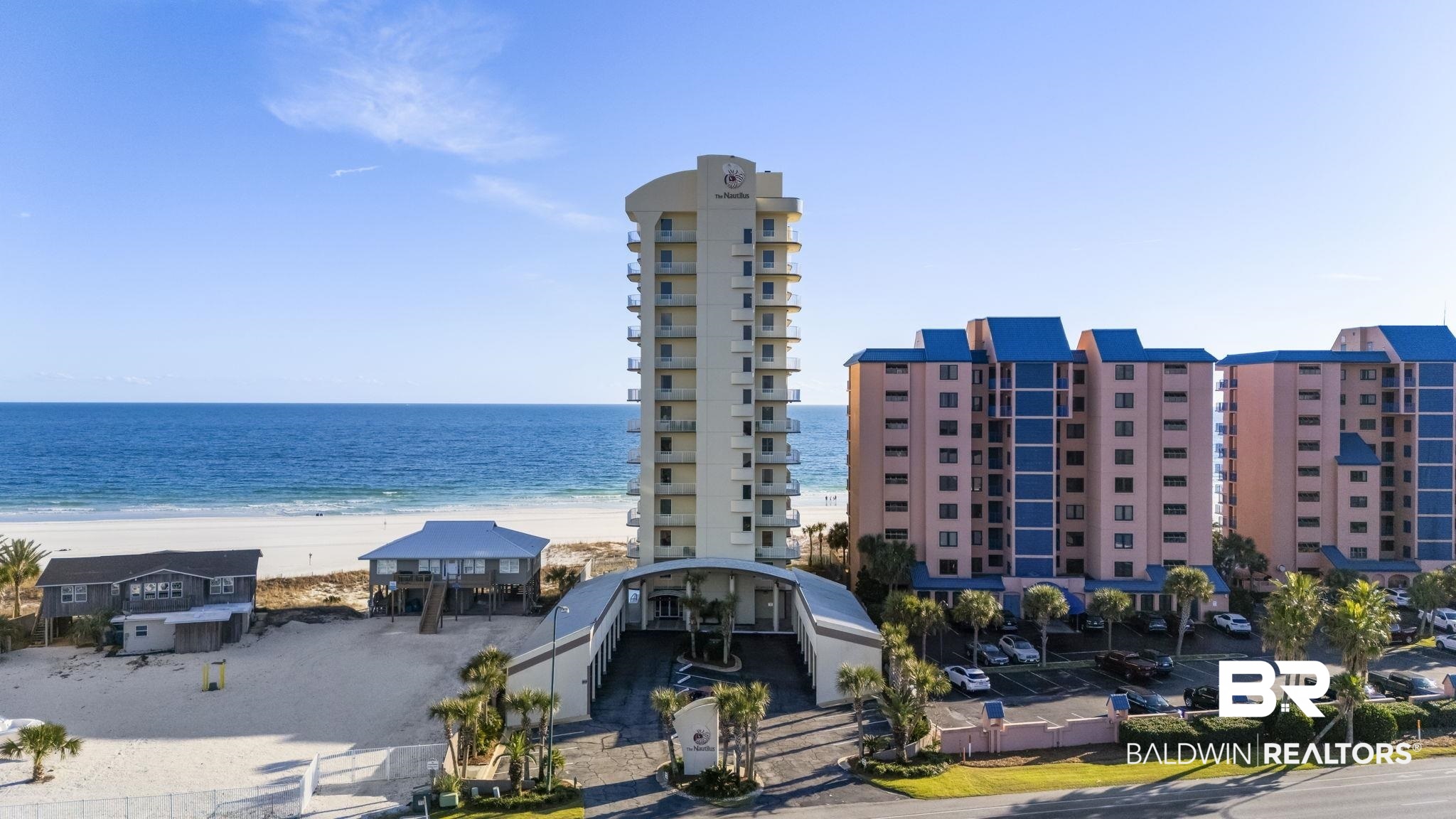 Premier Gulf-front condominium offering a private, full-floor residence at The Nautilus, a boutique building of only 12 units. Unit 4 occupies the entire fourth floor and delivers unobstructed 360-degree Gulf Coast views, creating an exceptional sense of space and privacy. A private elevator with secure code access opens directly into the residence, which features four bedrooms, four-and-a-half bathrooms, recessed lighting throughout, expansive living areas, and a gourmet kitchen equipped with stainless steel appliances, along with a wet bar featuring a sink and icemaker, ideal for entertaining. The unit is offered fully furnished and includes covered, deeded assigned parking and deeded outdoor storage. The Nautilus complex provides first-class amenities including a Gulf-front outdoor pool, indoor heated pool, hot tub, sauna, steam room, fitness center, BBQ area, outdoor shower, and a private boardwalk offering direct access to white, sugar sand beaches. Ideally located in the heart of Orange Beach, Alabama, just minutes from dining, shopping, and local attractions. Buyer to verify all information during due diligence.