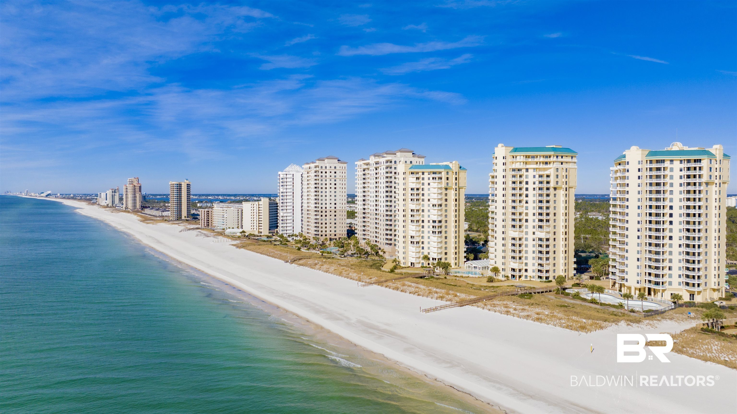 OWNERS & GUESTS LOVE BEACH COLONY! SITUATED IN THE HEART OF PERDIDO KEY AND WITHIN CLOSE PROXIMITY TO RESTAURANTS, SHOPS, NEW MULTI-USE PATH & THE NATIONAL SEASHORE! INDULDGE IN THIS EAST-CORNER, 3BR/3BA RESIDENCE IN THE WEST BUILDING WITH ITS BEACH HOUSE FEEL AND SPACIOUS BALCONY OFFERING STUNNING VIEWS OF THE GULF OF MEXICO. This residence has been a primary residence but would be an excellent rental property with rental projections of $70K+. This floorplan is ideal for accommodating guests or multiple families, featuring a generously sized primary bedroom with gulf views, while the guest bedrooms are located down a separate hallway for added privacy. Enjoy panoramic views from the eat-in breakfast nook in the kitchen as well as additional seating at the breakfast bar. The large Gulf-front primary bedroom has sliding doors leading to the covered balcony as well as a large bathroom with double vanity, walk-in shower and amazing views from the picture window above the soaking tub! Thoughtful upgrades include plantation shutters, solid wood interior doors, built out primary closet, recessed lighting, and tile flooring throughout. Enjoy conveniences like full laundry room, hurricane shutters and large owners’ storage closet right outside your front door, perfect for storing all your beach essentials. With exceptional on-site management and one of the best amenity packages on the island, owners and guests enjoy exclusive access to white sandy beaches, 2 outdoor pools, indoor pool with a hot tub, tennis courts, and a well-equipped fitness room. Other amenities include a grilling area, dog park, coded elevators, and a community room. Experience the best of island living!