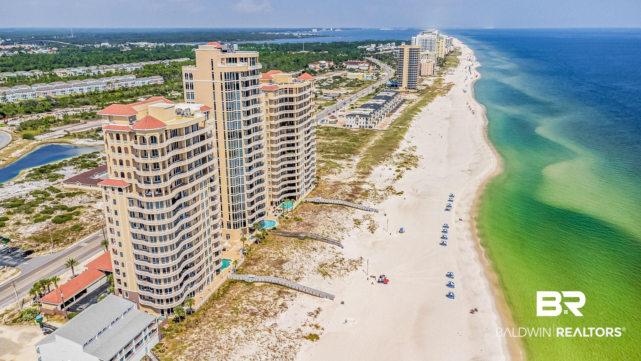 With custom interior design and stunning beach views, this one-of-a-kind penthouse residence is a masterpiece unlike any other along the Gulf Coast. Situated on 520’ of uncrowded beaches in the gated community of La Riva, where only 66 owners enjoy the privacy and relaxation afforded by a 1-year rental minimum.  Featured in Coastal Lifestyle, Penthouse 12 at La Riva Center Tower is literally out of the pages in a magazine. This sprawling 4,314 sf. beachfront home comprises the entire 12th floor and boasts unparalleled and panoramic views of the Gulf of Mexico and Perdido Key's beaches from 1,449 sqft. of expansive outdoor living space. This stunning residence has been professionally designed and furnished with every detail carefully selected including Italian marble floors and showers, custom kitchen and bathroom cabinetry, Schumacher wallpaper, and Visual Comfort lighting to name just a few. The open-concept floor plan is truly special with its multiple living and dining areas, two Gulf-front master suites, high-stretching 11' ceilings, and floor-to-ceiling impact-resistant glass with gorgeous views from almost every room.  The dreamy chef’s kitchen acts as the home’s focal point and features Calcutta Gold Marble countertops, sandblasted and weathered oak cabinetry, professional Viking kitchen appliances, gourmet island, and spacious pantry.  This ample space was designed for entertaining with separate wet bar, wine refrigerator, and butler’s pantry.  Penthouse 12 includes a coveted, COVERED DEEDED PARKING SPACE WITH CONVENIENT ACCESS TO THE LOBBY as well as climate-controlled owner storage closet. La Riva Center features the best of amenities with outdoor pool and hot tub plus heated indoor pool, sauna, steam room and fitness center all located on the 2nd Floor. Discover luxury and tranquility in this rare penthouse residence at Perdido Key’s premier luxury beachfront condominium. A detailed list of extensive upgrades is available upon request.