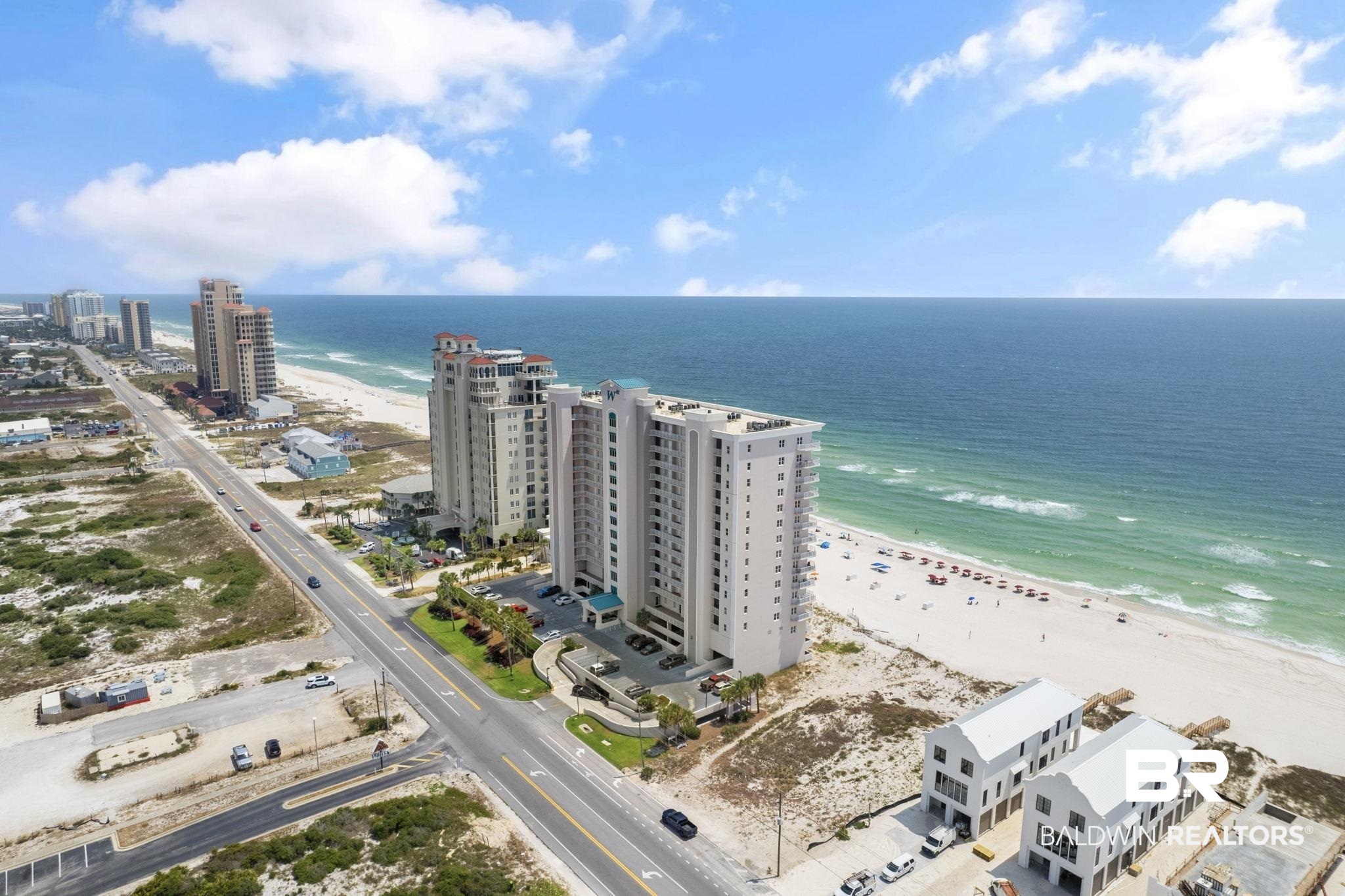 Experience the best of Perdido Key's beauty with this stunning FURNISHED 4-bedroom + CABANA, 4-bath beach getaway in Windemere. Elevated above the emerald waters on sugar white sands, this condo offers 300' of pristine beachfront along the Gulf of Mexico, and the WESTERLY VIEWS from your balcony are unbeatable. Boasting only 98 units, exclusivity and tranquility are guaranteed. Step inside and immerse yourself in the coastal ambiance of a condo that feels like home. The interior welcomes you with a fresh, coastal color palette and tile flooring throughout. The kitchen offers lots of cabinet and countertop space and stainless-steel appliances. Convenience is key, with an in-unit washer and dryer provided, making laundry at the beach a breeze! This turnkey condo offers immediate comfort, whether you choose to reside full time or utilize it as a rental investment. The primary bedroom is generously sized, accompanied by a modern master bath featuring a separate tub and shower. Each of the three guest bedrooms serve as junior suites - spacious, thoughfully designed and the perfect places to relax after a long day at the beach. The condo includes a dedicated covered garage parking space (#83). An extra bonus - AN ASSIGNED POOLSIDE CABANA! Sold fully furnished, it's ready to impress, and this unit is an established rental - completely turnkey and investment ready. Windemere grants residents and guests access to an elevated 3rd floor pool and sundeck area with seasonal heating, providing breathtaking Gulf-front views. Additional amenities include a fitness center by the pool and a spacious conference room with a kitchen. Here, luxury meets leisure, where you can live the coastal lifestyle to your fullest. Embark on a journey of discovery as you indulge in this beach sanctuary and its premier location on the Gulf. Your private escape awaits – come, experience, and fall in love with the allure of Windemere! Buyer to verify all information during due diligence.