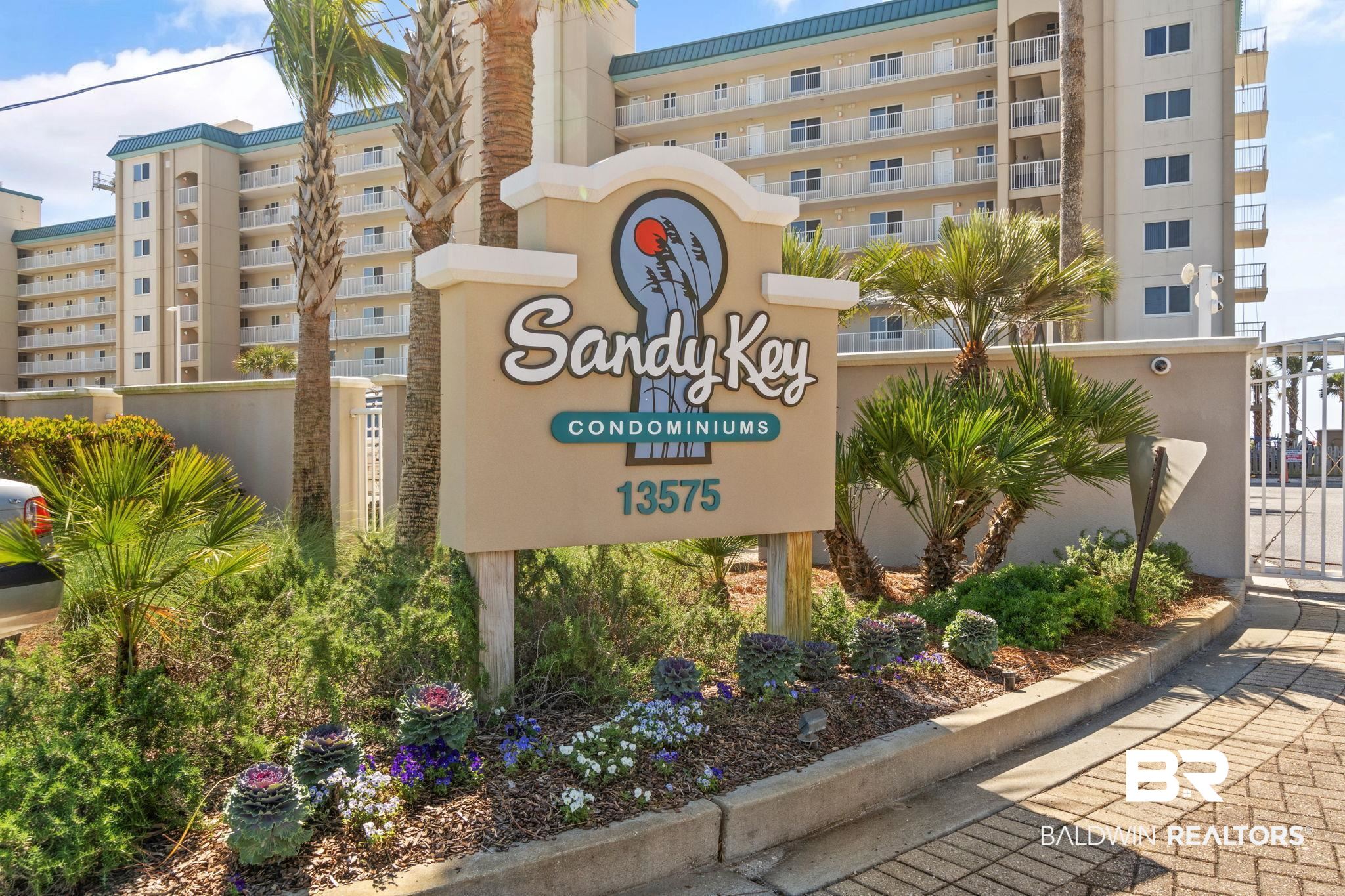 Experience beachfront living at its best at this beautiful 3-bedroom, 2-bath condo located in one of the most sought-after spots in Sandy Key, an END-UNIT on the TOP FLOOR with uninterrupted Gulf views. Offering two spacious balconies, one accessible from the living room & primary suite and another from the guest bedroom, this residence is perfectly designed for soaking up both sunrise skies & sunset hues. The kitchen is fully equipped with everything you need including stainless steel appliances and ample counter space, which is ideal for preparing meals after a day in the sand. Inside, the open-concept living & dining space is warm and welcoming, with room to unwind in comfort or gather around the large dining table for memorable meals at the beach. Step outside to the expansive balcony, where the gentle Gulf breeze & sound of waves create the perfect backdrop for relaxing or entertaining. Wake up in the primary suite to postcard-worthy views through dual Gulf-facing windows. The guest rooms offer generous accommodations as well, one with a king bed and the other with two full beds - making this a perfect setup for guests. This well-maintained unit is currently a successful vacation rental, offering outstanding income potential. Sandy Key’s amenities include two Gulf-front pools (one heated seasonally), hot tub, fitness center, lighted tennis & pickleball courts, BBQ areas, swings overlooking the dunes, & a gated entry—all just steps from the sugar-white sands of Perdido Key. With on-site HOA management & a peaceful, low-density beach, this is an incredible opportunity for a full-time residence, second home, or investment property. Buyer to verify all information during due diligence.