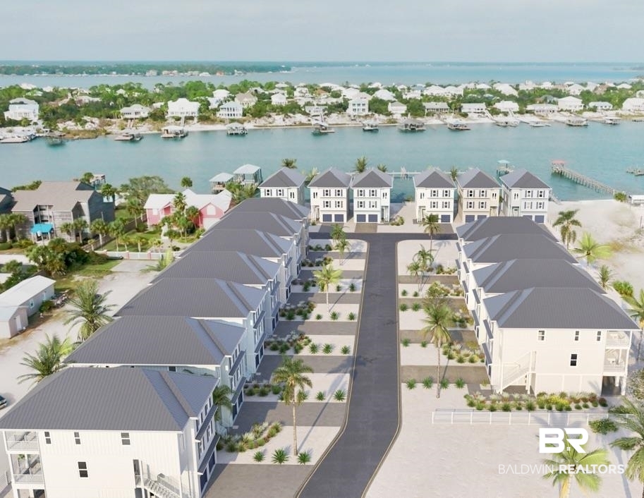 New Construction, PILINGS HAVE BEEN INSTALLED ON THIS GORGEOUS WATERFRONT CORNER LOT ON OLD RIVER READY FOR YOU TO CHOOSE YOUR COLORS AND FINISHES!! This Luxury waterfront single family home with Assigned boat slip on Perdido Key features 5 bedrooms and 5 1/2 baths with Elevator and enclosed 4 car garage, metal roof, Elevator, high end appliances, LVP flooring, Wet Bar, large decks overlooking Old River and plenty of room for friends and family or use as a Short Term Rental when you aren't enjoying the Boating Lifestyle on Perdido Key. New gated community with pool and pickle ball court and an additional 3 first come first serve boat slips as well as paddle board and kayak launch, all nestled on Old River.  Walking, cycling, boating, or paddling distance to Restaurants and Bars including the World Famous Flora Bama Lounge, Old River Grill, The Yacht Club and of course Waffle House!!. Enjoy time paddle boarding and kayaking as you explore the sparkling waters of Old River or take a walk to the Flora Bama and enjoy a bushwhacker as you stroll along the sugar white sands of the inviting Gulf of Mexico. Don't miss this RARE OPPORTUNITY to own a large waterfront single family home with private boat slip (buyer may install boat lift) in the charming hamlet of Perdido Key whether it's an investment, second home or your forever Dream Home!!
