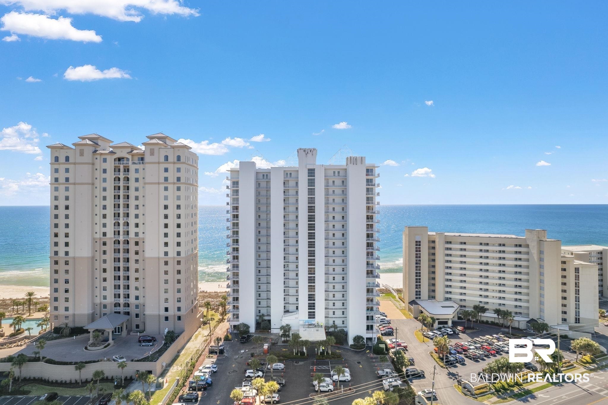 Coveted 3BR/3BA unit at Palacio with stunning Gulf views and updated interior décor! Tile flooring throughout the condo offers a clean appealing look with great interior flow and easy upkeep. Sold completely furnished, this beautiful residence includes a separate wet bar in the dining area, and a laundry alcove just off the kitchen with a full side by side washer and dryer. The generous Primary Bedroom Suite has a walk-in closet and dressing vanity, the ensuite bath offers a jetted tub, separate walk-in shower and private water closet. The 2nd bedroom features a king-sized bed with full ensuite bath, making it a comfortable private retreat for your guests. The 3rd bedroom features a bunk set up with a twin bed over a double, allowing additional sleeping space. Finishing touches such as crown molding, baseboards, and floor to ceiling windows and slider doors make Palacio a standout on Perdido Key. Located directly on the beautiful Gulf of Mexico, Palacio is within walking distance to more than eight miles of unspoiled nature preserve in the Gulf Islands National Seashore. The complex features a conference room, community pool with sundeck, heated lap pool, hot tub and fitness room. Two tennis courts and a gazebo picnic area are directly across the street. There is covered garage parking available to owners only. Don’t let this beauty get away, make an appointment to see it soon! Buyer to verify all information during due diligence.