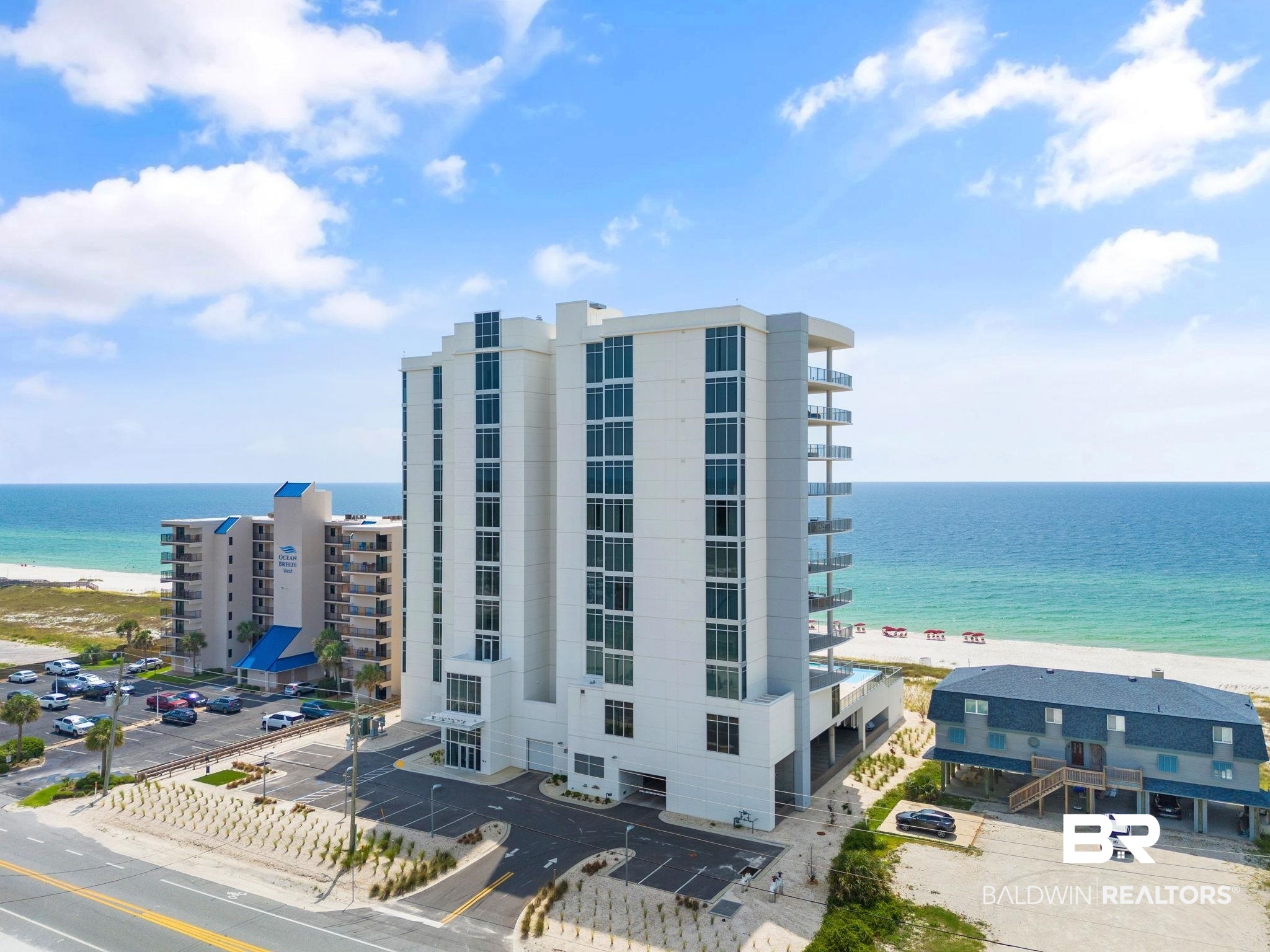 EXPERIENCE SOPHISTICATED RELAXED BEACHFRONT LIVING in this newly constructed, boutique condominium boasting unparalleled views of the Gulf of Mexico. Portico at Perdido is a rare gem located in the heart of Perdido Key, where owners and their guests enjoy low-density luxury living with only 27 residences. Professionally decorated by one of the area’s most sought-after interior designers, this exquisite residence boasts high-end furnishings, accessories, and lighting as well as custom cabinetry featuring a stunning, floating living room console and bar cabinet. With four bedrooms and four bathrooms, this spacious residence features a living, dining area and kitchen wrapped by floor-to-ceiling glass where you can experience sweeping Gulf views from inside your beach home. An extensive 852 sf. wrap-around balcony ensures uninterrupted views and endless opportunities from multiple seating and dining areas.  A custom outdoor kitchen with built-in gas grill leads directly to a modern indoor kitchen featuring an eight-foot island with integrated seating and waterfall Calacatta quartz tops, Bosch stainless appliances, gas stove, free-standing ice maker, and walk-in pantry. The stunning Primary Suite is exquisitely decorated with a sitting area and private access to the balcony. Enjoy a spa-like primary bathroom with freestanding soaking tub, separate shower, double vanities, and custom-designed walk-in closet. Three guest bedrooms with en-suite bathrooms are separate from the primary suite offering added privacy. Overlooking Gulf waters are Portico’s stellar amenities which include outdoor infinity pool and spa, heated indoor pool with seating ledge, and well-equipped fitness center.  Secure covered parking and climate-controlled owner storage are located at the ground level for convenience. Explore nearby attractions from award-winning golf courses and boating to boutiques and boating. The luxury beachfront lifestyle away from the crowds awaits at Portico at Perdido! Buyer