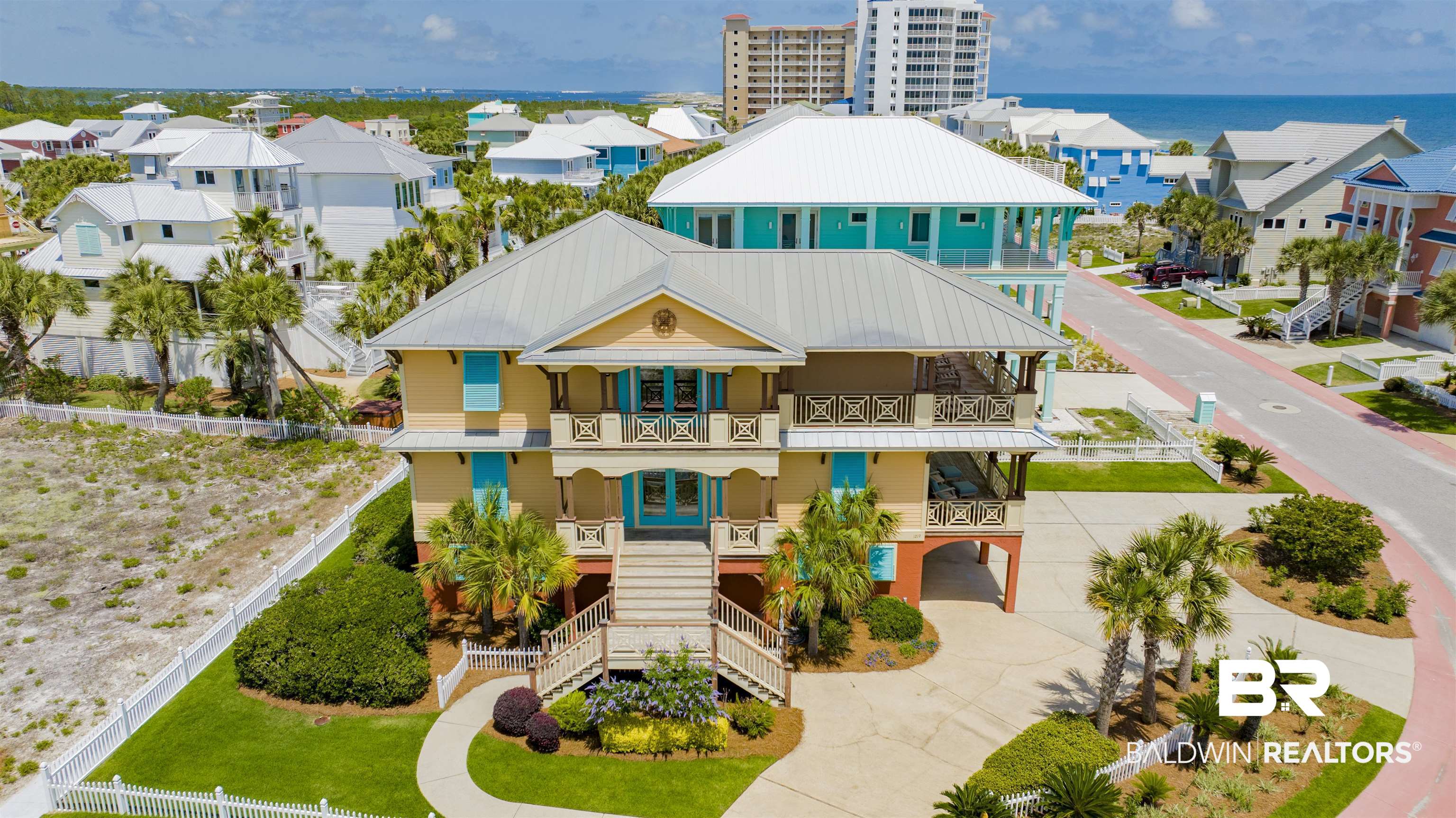 Here it is—your rare chance to own a true beach home in the exclusive, gated, rent-restricted community of Parasol, offering over 900’ of private, sugar-white beachfront. This furnished 4-bedroom, 4.5-bath residence sits on a generous corner lot designed to showcase Gulf views & capture the essence of coastal living. Expansive balconies & deep, covered porches invite you to unwind, dine outdoors, or simply listen to the waves roll in—this is living at its finest. Step inside to find each level—accessible by ELEVATOR—offering its own living quarters, making everyday life or hosting guests a breeze. The main floor is light-filled with fresh paint, soaring coffered ceilings, travertine floors with hardwood accents, & a seamless flow that connects the indoors to the Gulf beyond. The coastal-inspired kitchen boasts granite counters, stainless appliances, a wine cooler, ice maker, custom tile backsplash, & an elegant dining area highlighted by a stunning beachy chandelier—perfect for entertaining or everyday meals. A private suite with en suite bath & walk-in shower, along with a laundry area & half bath, completes the main level. Upstairs, the third level features two luxurious primary suites, one with balcony access, two full baths, & two flexible living spaces—one with a bar, sink, & wine cooler that opens to your Gulf-facing balcony. Imagine enjoying a sunset or dining al fresco with the beach as your backdrop! Downstairs, the first level provides a unique layout with private living space, full bath, large bedroom with sitting area, plus its own washer, dryer, & fridge—ideal for accommodating all your living space necessities. No carpet throughout, plantation shutters, three garages, & plenty of storage for all your beach gear. HVAC (2020) & water heaters (2018) already in place. Located by the private beach access, community pool, & the National Seashore. Come experience the Gulf Coast lifestyle you've always dreamed of—this beach home is calling. Buyer to verify all