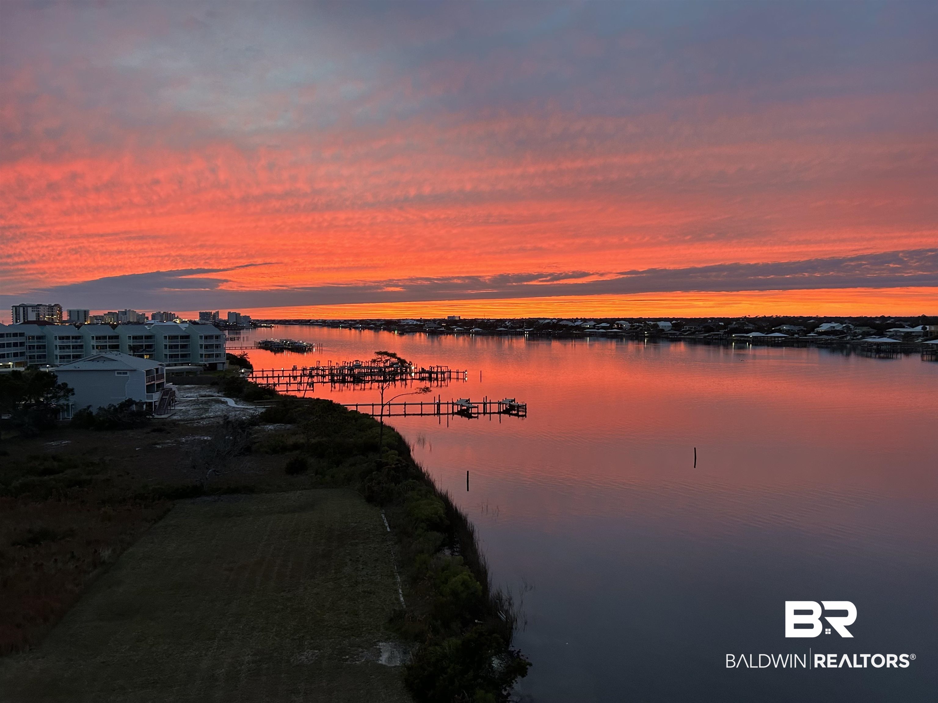 EXPERIENCE SWEEPING VIEWS OF OLE RIVER, ONO ISLAND, AND THE GULF OF MEXICO FROM THIS 6TH FLOOR 3 BEDROOM, 3 BATHROOM WEST CORNER RESIDENCE AT SEASPRAY RIVERSIDE! YOU CAN HAVE IT ALL WITH ACCESS TO FULL BOATING FACILITIES ON-SITE AND BEACH ACCESS ACROSS THE STREET! Enjoy paradise right away as this residence comes FULLY FURNISHED! Relax and take in the passing boats from your private wrap-around balcony accessible from the living room, dining area, and Master Bedroom. The open kitchen layout with a generous island, stylish cabinetry, granite countertops, and breakfast bar is ideal for cooking enthusiasts and hosts alike. The master bedroom features an ensuite bath, dual vanity, separate shower, and spacious walk-in closet. SeaSpray residents and guests relish in outstanding amenities such as two gulf-front pools (including one with zero entry), a riverside pool, fitness center, tennis/pickle ball courts, pier, docks, kayak storage, and exclusive beach access. SeaSpray offers exceptional on-site management, rental services, and maintenance staff along with a well-established homeowners' association with competitive HOA fees. Embrace the relaxing Island Life at Seaspray Riverside 611!
