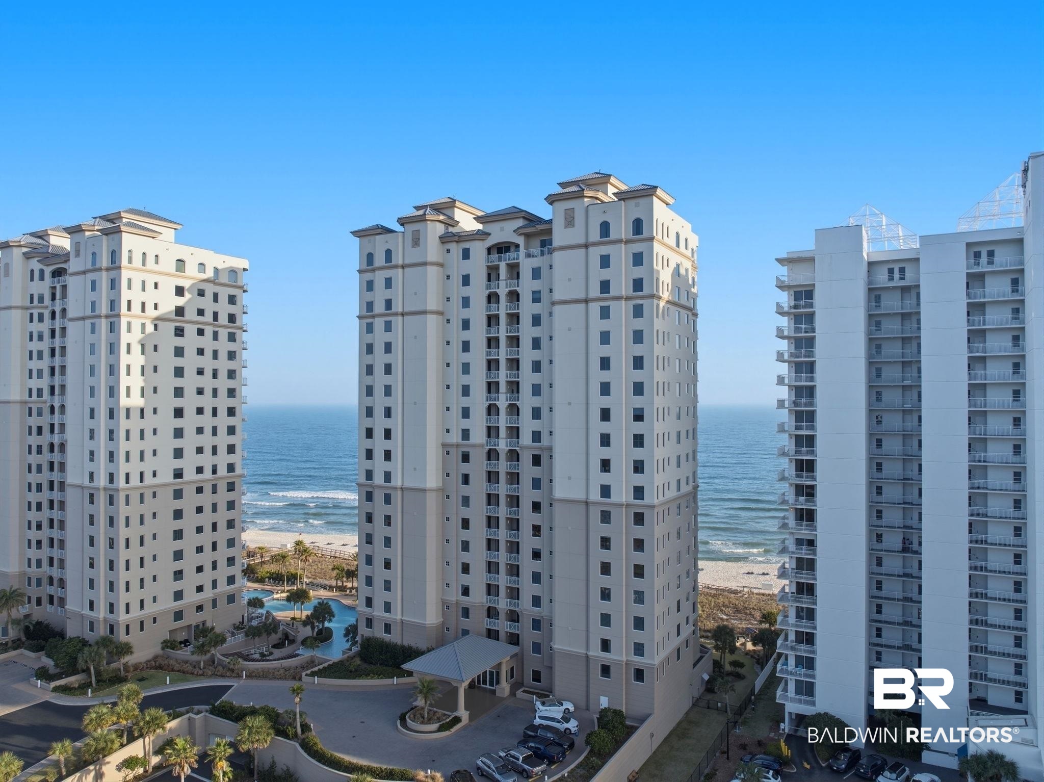 Discover your beachfront paradise at Indigo #803W, where coastal luxury meets breathtaking Gulf views on Perdido Key. The elevator will open at your 8th floor location where you will enter your private foyer before stepping into this beachfront oasis. Furnished with coastal décor & touched with true coastal elegance, this 3-bedroom, 3-bath condo is not a vacation rental, but holds the potential to be an income producer or remain a secondary residence. The open-concept layout invites you to soak in panoramic Gulf views through floor-to-ceiling windows. The fully updated kitchen shines with quartz countertops, stunning backsplash, stainless steel appliances, custom cabinetry with smooth glide pull-out shelving, & space for serving & entertaining guests. The spacious dining & living area showcases the Gulf where you have direct views overlooking the beautiful beaches. The primary suite, with direct views of the emerald waters, is an escape like none other. Step onto the beachfront balcony accessible from both the living area & primary suite, a place to enjoy a book, a beach view & the Gulf breeze. Two additional bedrooms, designed as secondary suites, provide their own slice of paradise, each opening onto a shared north-facing balcony with breathtaking views of the Intracoastal Waterway. You truly have the best views of both worlds. Designed for effortless coastal living, this residence offers both comfort & convenience with covered parking, a climate-controlled storage unit ideal for beach gear, & a recently replaced water heater (2021). Indigo, a gated 6-acre beachfront resort, features an impressive lineup of amenities including elegant lobbies, owner’s community rooms, a newly updated fitness center, a movie theater, tennis & pickleball courts, a zero-entry pool, & a relaxing hot tub. Located across from dining & shopping, this condo presents an exceptional opportunity for a personal retreat or an income-producing investment. Your place on the Gulf awaits!  Buyer t