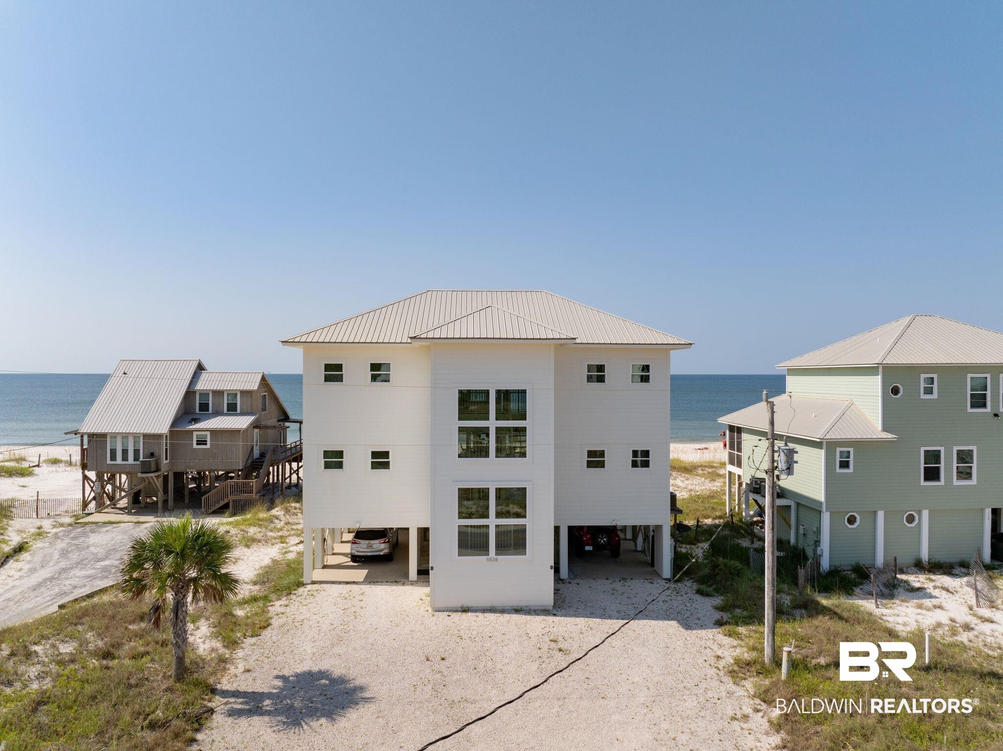 Experience luxury in this stunning gulf-front home, recently updated to enhance the coastal living experience. This spacious 4-bedroom, 4.5-bath residence boasts an open floor plan, ideal for both entertaining and relaxing. The gourmet kitchen features new, high-end appliances, while each of the updated bathrooms showcases contemporary vanities and stylish finishes. Enjoy breathtaking gulf views from every bedroom, each with its own private balcony. High Impact windows/doors have been installed throughout the entire house. A new HVAC was installed in 2023. Recently designed with upscale furnishings. The house is being sold fully furnished. No rental restrictions and no HOA. Don't miss the opportunity to own this exceptional home where every detail has been thoughtfully curated for the ultimate coastal lifestyle.  Buyer to verify all information during due diligence. Agent is related to the Seller.