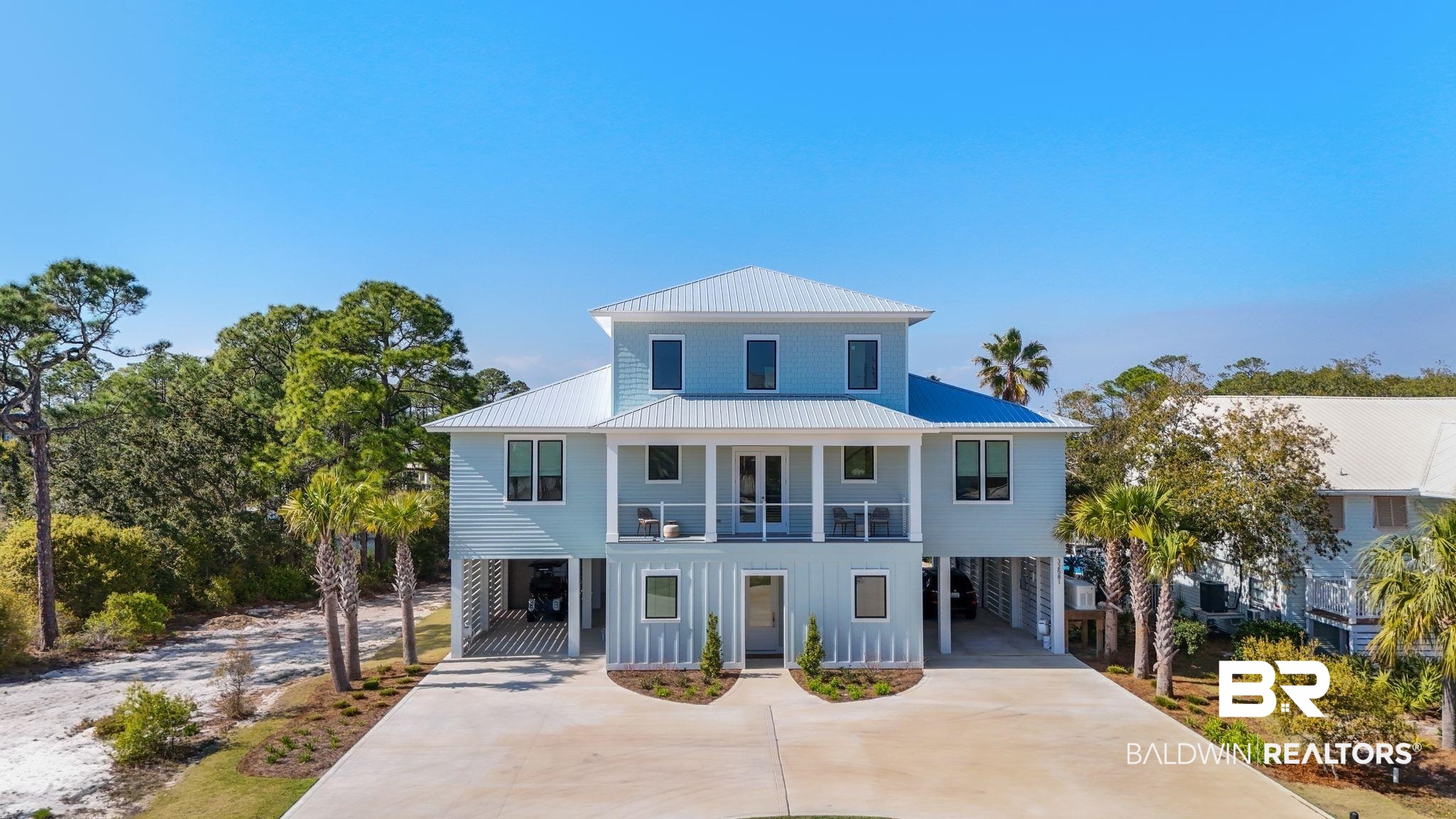 Situated on Ono Island with canal frontage and quick access to the Intracoastal Waterway, this 5 bed/4.5 bath residence offers a refined coastal lifestyle with a strong emphasis on outdoor living and boating accessibility. Designed for both everyday living and entertaining, the home features 10-foot ceilings, engineered oak flooring, solid wood doors, and a spacious living area. The kitchen is anchored by a butler’s pantry and opens seamlessly to the main living and outdoor spaces. The primary suite is thoughtfully designed to take advantage of the canal setting and includes a walk-in shower, freestanding soaking tub, dual walk-in closets, and detailed millwork. Outdoor living is a true highlight, with approximately 1,798 square feet of covered space, a screened in porch, built in cook center, and a newly added pool and hot tub. A dedicated outdoor shower and half bath provide added convenience for pool and boating days. Additional features include a whole home Generac generator and prewiring for speakers and security. A third level bonus room offers flexible space for a guest suite or secondary living area, complete with a sink and full-size refrigerator. The property is approved for a future boat dock, offering direct canal access and an easy route to open water. Ono Island is a private, gated community offering a boat launch, tennis courts, pool, clubhouse, and fitness center. Buyer to verify all information during due diligence.