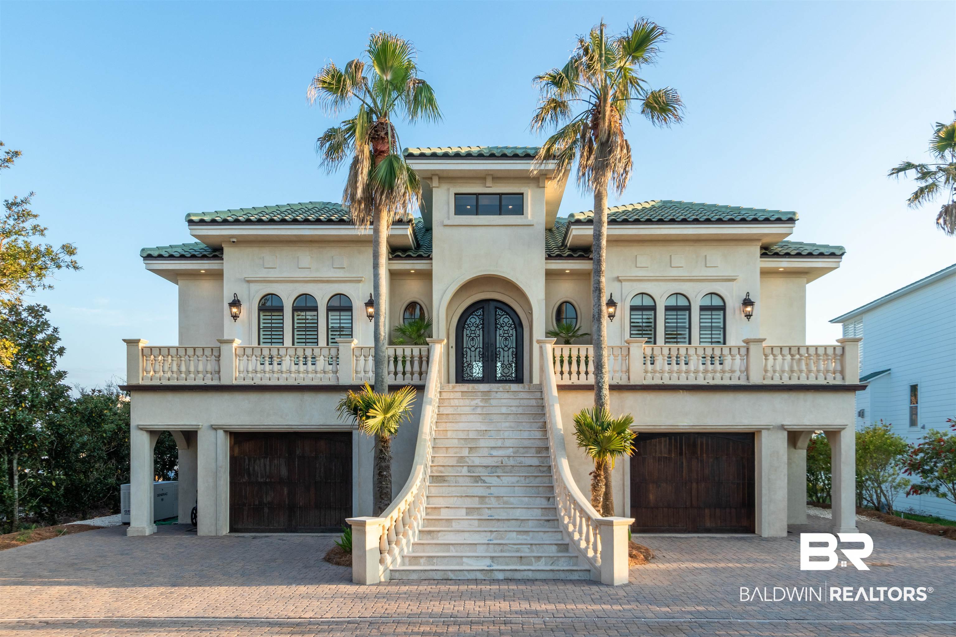Be prepared to be impressed. Spread over a spacious 5,465 square feet, this ICF smart home is a true masterpiece of design and craftsmanship. From the moment you step inside, you'll be captivated by the soaring 12' ceilings, elegant finishes, and high-end features throughout.   The main living area is spacious and inviting with an open floor plan that seamlessly blends the living, dining, and kitchen areas. The gourmet kitchen is a chef's dream equipped with high end appliances, including a subzero 36” refrigerator with a matching subzero 30” freezer, a viking range with a viking professional vent encased in a limestone hood. With custom cabinetry and plenty of counter space for meal prep, this kitchen is perfect for entertaining.   The bedrooms are equally impressive, each featuring their own en suite bathroom for ultimate convenience and privacy. The primary suite is a luxurious retreat, complete with a spa-like en suite, including dual block glass and limestone showers (steam shower & multiple shower heads) and a private veranda overlooking Old River.   The outdoor space features a built-in kitchen with a gas grill, sink, and granite countertops. Spacious upper level veranda with ample seating is perfect for entertaining guests and enjoying the panoramic views. Watch sunset on the private sandy beach overlooking Ole River.    The property also features a private boat dock with two lifts, Pontoon Hi-Tide lift 4,500 lbs and 2nd Hi-Tide lift 10,000 lbs, providing easy and convenient access to the water for all your boating and water sport activities. Pilings on pier and dock have been wrapped in marine construction encapsulations.