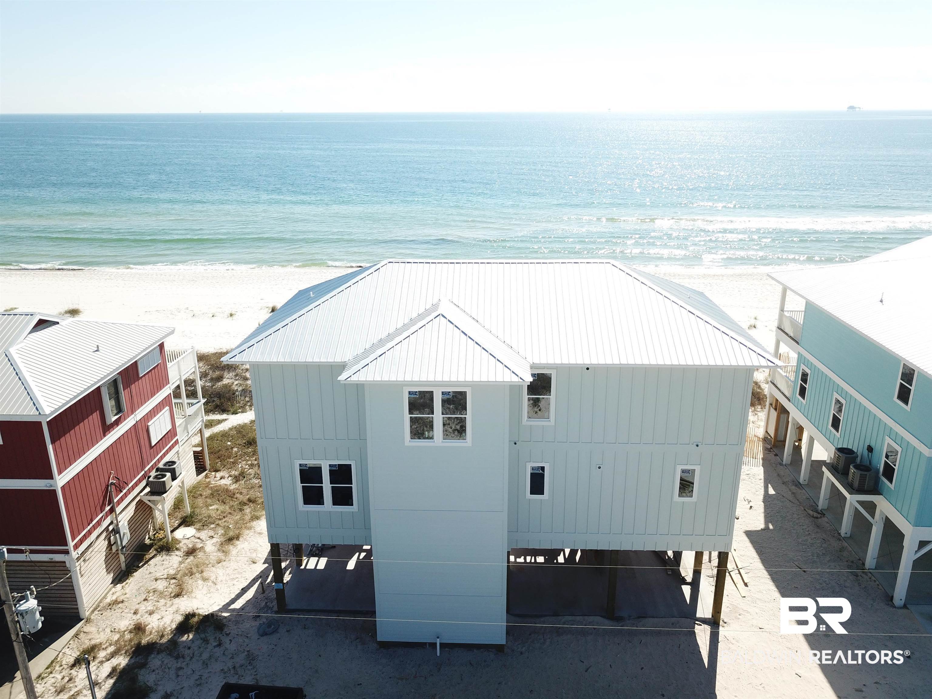 Brand new, 5 bedroom, 6 bath direct Gulf front home with Gulf facing heated pool on the lower deck. Private Trex decks on first and second level facing the sugar white sands of The Gulf of Mexico. All 5 bedrooms have a direct Gulf view! Built in bunk beds in upper hallway. Large 75 x 375' lot. Gold Fortified with upscale finishes. Full stainless appliance package including full sized washer & dryer. Private elevator. Heated and cooled entry and beach boardwalk. Outdoor shower. Lots of parking! Incredible unobstructed views. Great short term vacation rental and ready for summer rentals. Lots of parking. Zoned A/C Wi-Fi thermostats. Interest rate incentive offered with use of sellers preferred lender or up to $30,000 in closing costs + $30,000 furniture credit with acceptable offer!