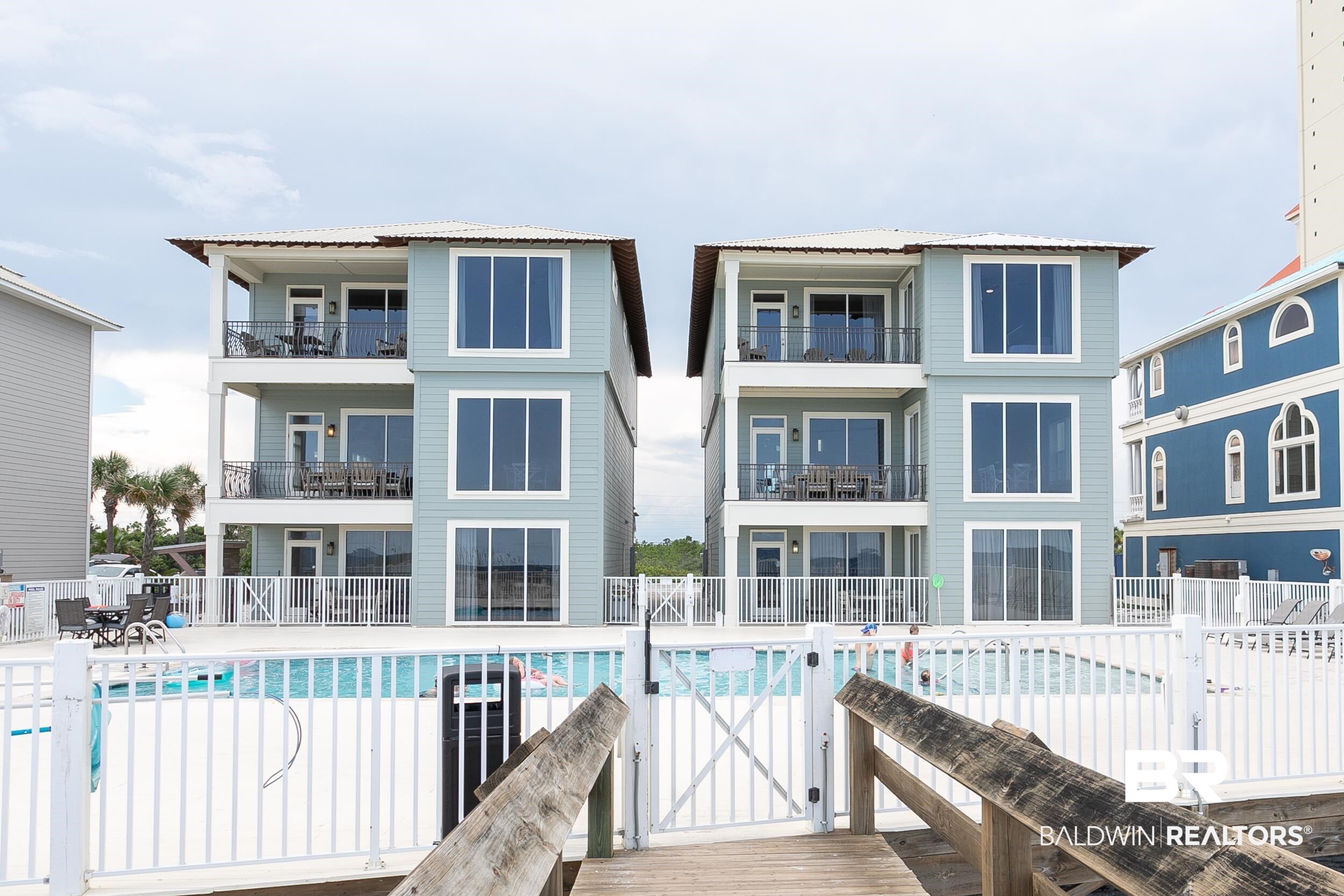 *RARE OPPORTUNITY* to own HAMMOCK DUNES WEST, a beautiful, direct GULF-FRONT, 7 bedroom/7 bathroom HOME, with a community GULF-FRONT POOL, in ORANGE BEACH! An impressive 5,169 sq ft makes up this massive 3-story home. Each level captures panoramic views of the gulf and its white-sand beaches with floor to ceiling windows and their own gulf-front balconies. Upgrades are found throughout with walk-in tiled showers, granite countertops, stainless steel kitchen appliances, and all flooring is tile, LVP, or wood, NO CARPET!! The freshly painted exterior and interior as well as all new furnishings, light fixtures, ceiling fans, and kitchen backsplash have this home in like-new condition. The second floor consists of 2 bedrooms, one with an ensuite bathroom, 2 bathrooms, main living area, kitchen, and dining area. The third/top floor has 2 gulf-front master suites, each with their own ensuite bathroom and private access to the gulf-front balcony. The first/ground floor has 3 bedrooms, 3 bathrooms, living/dining area, and a kitchenette. One bedroom is a gulf-front master suite with private access to the patio, the other 2 bedrooms are set up as bunk rooms, one with an ensuite bathroom. The gulf-front community pool is right out your backdoor and with just a few more steps you’ll have your toes in the sand. Hammock Dunes West is a great rental property that can sleep up to 28 guests. Want to take your investment portfolio to the next level? Hammock Dunes East is also for sale (MLS 334061) giving you the opportunity to offer a total of 14 bedrooms/14 bathrooms for guests to rent! Don’t miss out on this rare opportunity to own a gulf-front home (or two!) in Orange Beach!