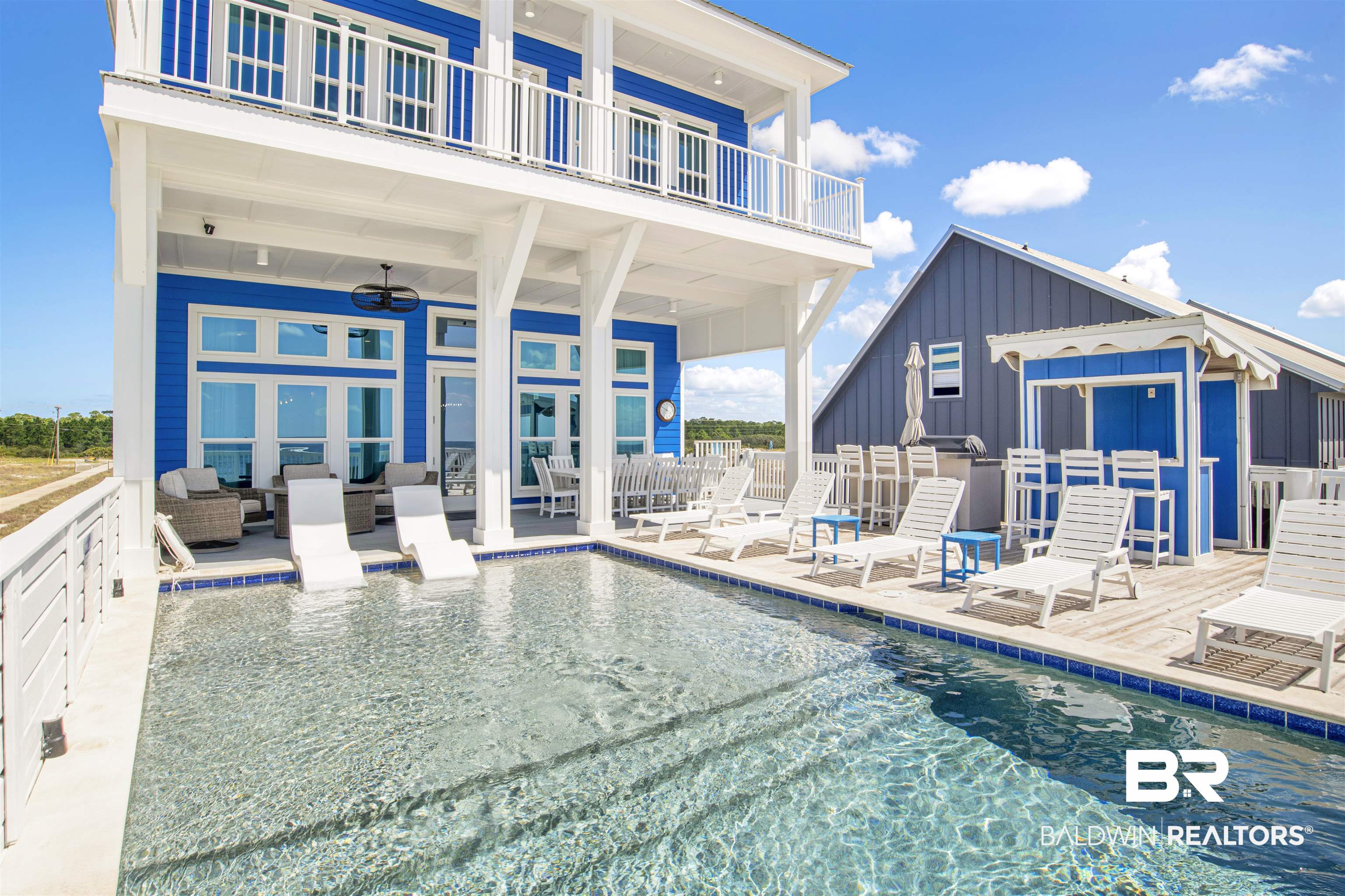$25K USE IT YOUR WAY SELLER CONCESSIONS WITH AN ACCEPTABLE OFFER! Discover the ultimate beach retreat at this stunning FFSL CERTIFIED (1 out of approx. 1,200 in the whole country at the time of building) 6-bedroom, 6.5-bathroom + bonus room gulf-front masterpiece in the coveted Fort Morgan area of Gulf Shores, Alabama. Nestled along the pristine shores of the Gulf of Mexico, this exquisite property offers an unparalleled beachfront living experience. Step inside and find yourself in the spacious main room with an open floor plan designed to capture breathtaking views of the Gulf. The living area features high ceilings, large windows to seamlessly connect the indoor and outdoor spaces, a cozy gas fireplace, and a wet bar with an ice maker and wine cooler! The gourmet kitchen is a chef's dream, equipped with top-of-the-line stainless appliances including a gas cooktop, two ovens, two refrigerators, two dishwashers and a microwave. The generous island and adjacent dining area is perfect for preparing and enjoying meals with family and friends. One bedroom resides on the main floor with a handicap accessible bathroom. Take the elevator upstairs to find the remaining 5 bedrooms, bonus room and the second laundry room. The primary suite boasts luxury, with plenty of space for leisure in the sitting area, an incredible walk-in shower and a soaking tub. Outside, the expansive deck overlooks the sugar-white sands and emerald waters of the Gulf, providing an ideal setting for relaxation. Soak in the sun by the private pool, make a drink under the cabana, cook lunch on the grill, take a stroll on the beach, or simply relish in the serenity of this exclusive waterfront property. Located down Fort Morgan, you'll enjoy the perfect blend of tranquility and convenience, with easy access to golfing, fishing, and the charming amenities Gulf Shores has to offer. This Gulf-front masterpiece is not just a home; it's a lifestyle! (Seller concession must be written in offer)