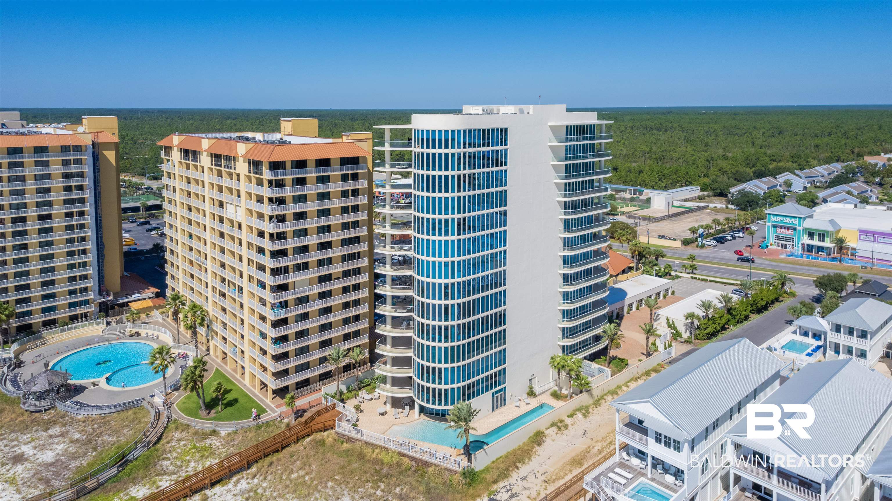 Welcome home to Opal Condominium, the premier low-density gulf front development in Orange Beach! Featuring 1 unit per floor, gated entry, coded lobby entry & elevator access to your personal unit Foyer. This phenomenal unit offers five bedrooms, five and one-half baths. Enjoy panoramic gulf views from the floor to ceiling windows spanning the living and dining areas. There are two primary suites - one gulf front, the other on the north end. The gulf front primary suite offers a walk-through closet, bubbling overflow soaking tub and separate shower. Gorgeous kitchen with tiled backsplash, Kitchenaid gas range and kitchen appliances, 4,330+/- square feet - this unit is exceptionally spacious, offering plenty of room for comfort and entertainment as well as an icemaker and beverage cooler. Opal offers an indoor pool with entertainment area, zero entry outdoor pool with hot tub, fitness room and more! This exceptional property is exceedingly well done and is a must see for the discerning buyer.
