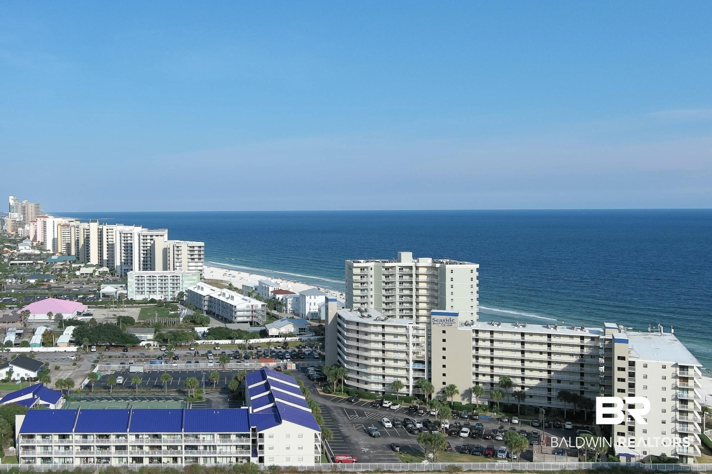 Price Reduced! Come discover a true beachside oasis at Seaside Beach & Racquet Club in Orange Beach, Alabama. With its fabulous amenities on the white sand beaches of the Gulf of Mexico, Seaside unit #1215 is an updated and spacious 1-bedroom condo located in the tennis villas and right next to the indoor pool, tennis courts, and fitness room. The unit has Gulf views from the balcony and an inviting living space that is simply perfect for a relaxing getaway or use as an affordable vacation rental investment. In mid-2022, the residence was updated with a new stainless stove, microwave, and dishwasher, a new water heater, new light fixtures/fan, balcony chairs and interior furnishings, a new toilet, and all new electrical switches, covers and outlets with GFCI/USB. In August 2023, new kitchen and bathroom countertops and sinks were installed and the entire unit was painted. The condo can comfortably sleep 4 thanks to the queen sleeper sofa, and the unit is being sold with all furnishings, appliances, electronics, decor, linens, and household items included. It is ready for continued rentals and 100% turnkey! Seaside Beach & Racquet Club offers a host of resort-style recreational amenities including 2 Gulf-front pools, an indoor pool, sauna, steam room, tennis courts, shuffleboard, fitness center, on-site management, security guard at gate, and BBQ grills and picnic area by the shore. The tennis villas also had a new metal roof installed on the building in late 2022, and with the beautiful Romar Beach access (currently being updated) next door, there's no building to block your water views! A 1-year Home Warranty is active and can be transferred to the new owners, and the rental history and rental projections are available. The iconic multicolored Adirondack chairs at the shoreline are waiting for you, so come kick up your feet and start enjoying the Seaside lifestyle! Buyer to verify all information during due diligence.
