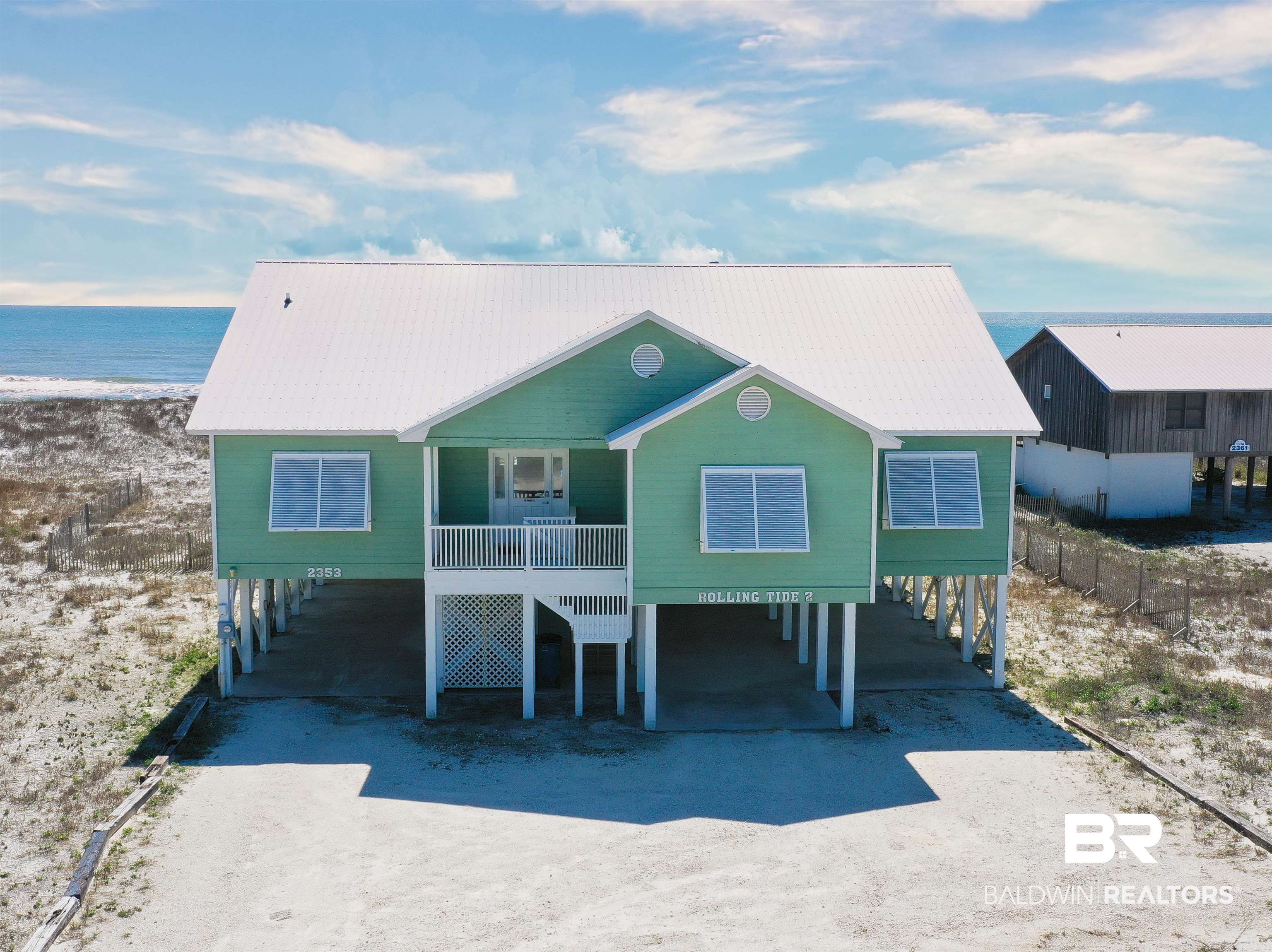 RARE ONE LEVEL 5BR/3BA HOME ON 100 FT. GULF FRONT LOT ON WEST BEACH IN GULF SHORES.  This recently updated beach home has all you could want.  It has a private boardwalk to the beach. Enjoy sunsets and entertaining from the gulf front, large covered and sunning decks.  The home features 2 primary gulf front suites.  Enjoy views from the open floor plan through the large windows allowing grand views of the sandy white beach and beautiful Gulf of Mexico. There is an electric fireplace in the living room...a perfect place to entertain family and friends. No carpet  - LVP flooring throughout. Metal Roof.  SOLD FURNISHED AND RENT READY!