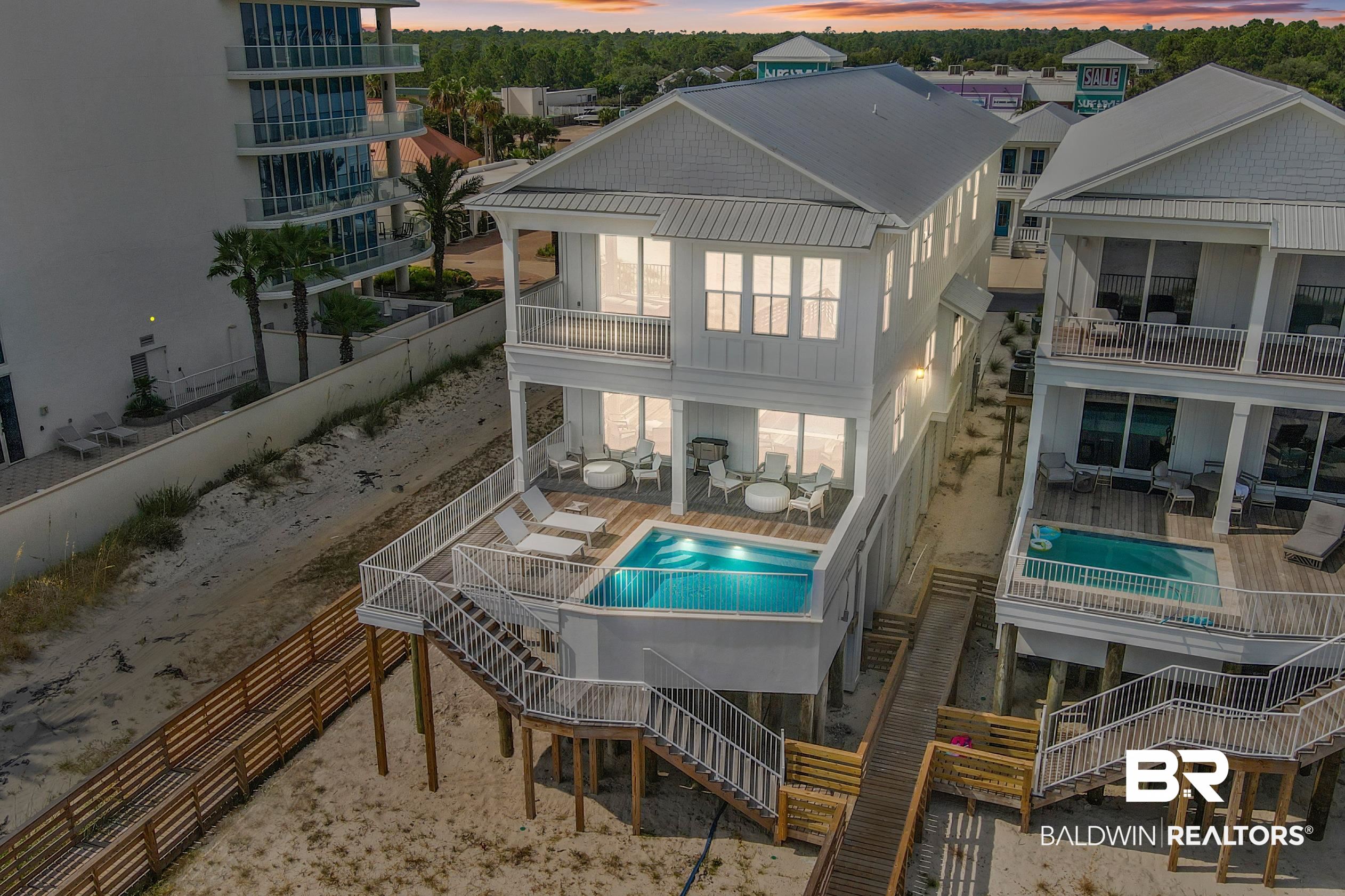 Ocean Edge GULF FRONT Home! This Gold- Fortified Custom built home features an open floor plan, expansive views, 6 bedroom, 7.5 bath with media room, bunk room/study, private pool with large deck space to enjoying soaking up the sun. Wood Floors, Quartz Counter tops, Custom Tile Showers and Tub surrounds, Custom Cabinets and much more! Fantastic second home or phenomenal investment.