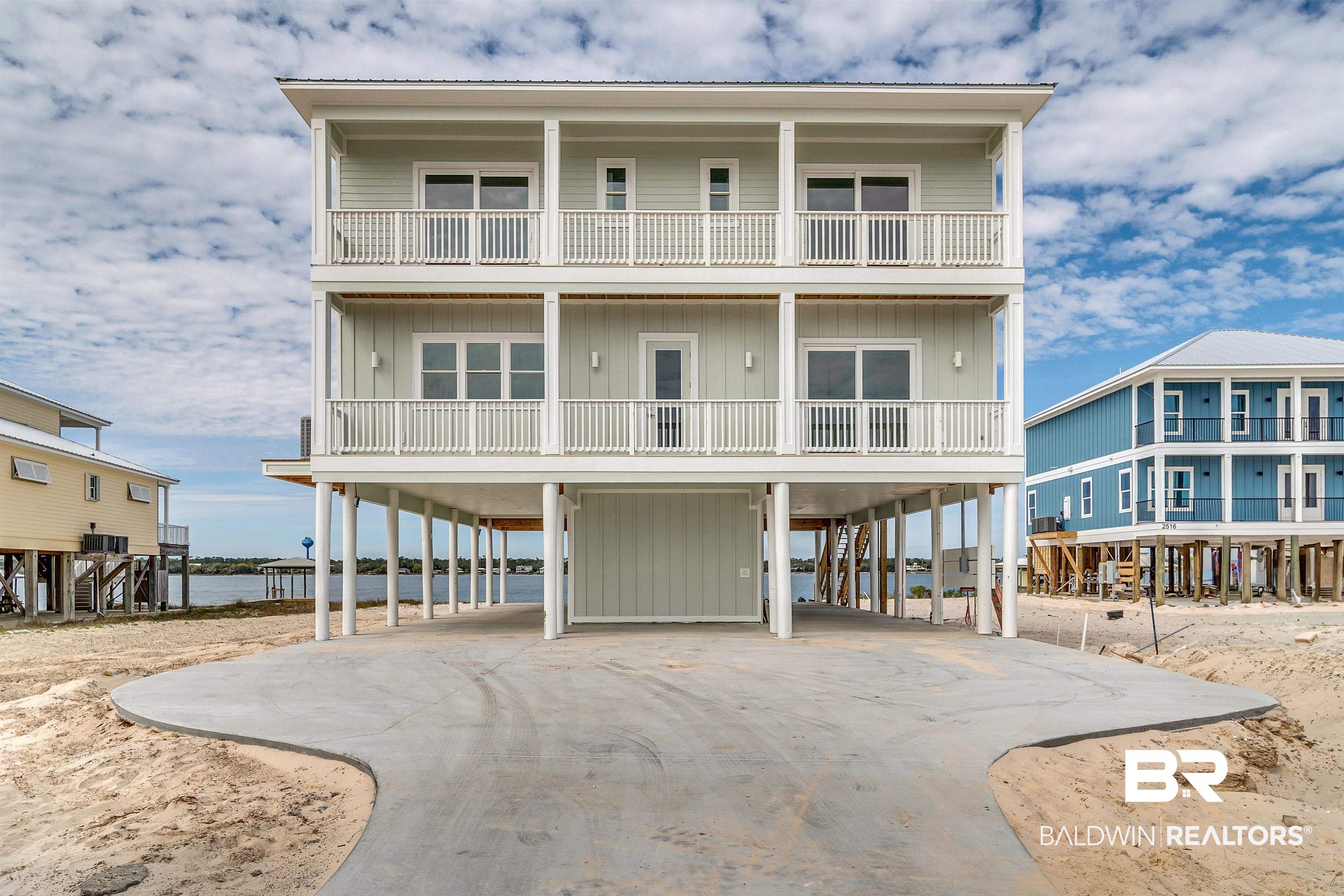 Your stunning, gold fortified beach retreat is ready! This 7 bedroom, 7.5 bath home is located on Little lagoon with amazing Gulf Views. Inside, high-end finishes, spacious rooms, and gourmet kitchen create an opulent coastal experience. Enjoy convenience and accessibility with the elevator that accesses all floors. The pool overlooks the lagoon and the decks provide ample space for lounging and socializing. It's the perfect spot to enjoy sun-kissed days and mesmerizing sunsets by the water's edge. Whether you seek a private retreat or an investment property, this beach home promises both tranquility and financial reward. Don't miss your chance to own this coveted piece of real estate-schedule a showing today and prepare to fall in love with your dream coastal getaway!