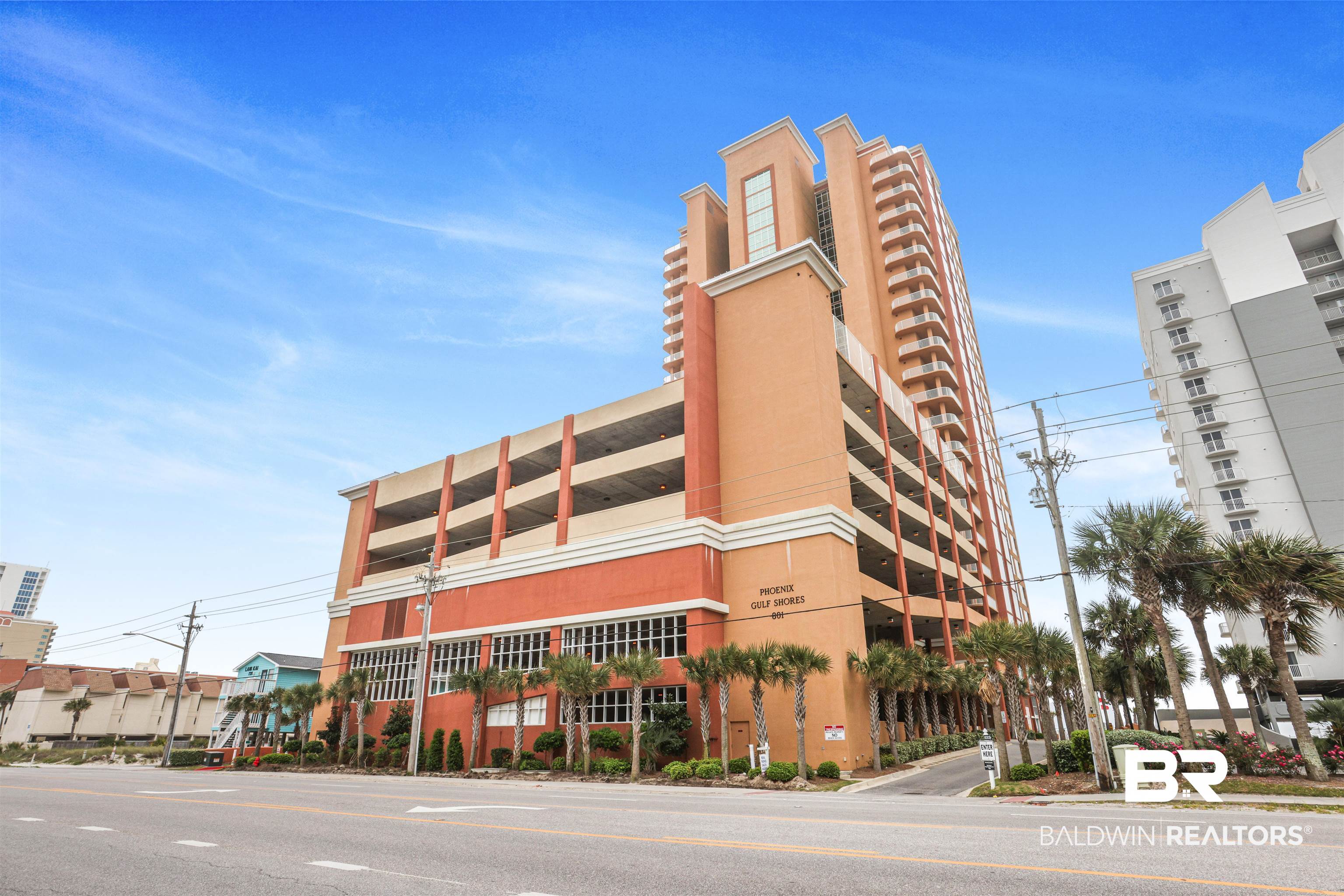 Nestled within the renowned Phoenix Gulf Shores Condominium Tower, Unit 1804 presents an exclusive five-bedroom, five-and-a-half-bathroom residence, embodying luxury living in Gulf Shores, AL. This premier condominium complex is renowned for its unmatched amenities and breathtaking views of Alabama's pristine white sandy beaches. Meticulously maintained by its sole owner and never before offered for rental, this property epitomizes sophistication and exclusivity.Upon entering, you're enveloped in an atmosphere of refinement, thanks to the bespoke floor plan crafted during pre-construction. Elegant plank tile flooring guides you from the foyer into the expansive main living area and gourmet kitchen. A thoughtfully placed half bath enhances the residence's functionality. Flooded with natural light, the living spaces offer panoramic Gulf views through floor-to-ceiling impact windows, seamlessly blending indoor comfort with the picturesque outdoors.The chef's kitchen is a culinary haven, boasting granite countertops, custom cabinets reaching to the ceiling, and top-of-the-line stainless-steel appliances, including a refrigerator with ice maker, double oven, cooktop, and microwave. Perfect for entertaining, the dining and living areas provide breathtaking views of miles of pristine coastline, complemented by a wet bar and large wall-mounted flat-screen TV.The luxurious master suite overlooks the Gulf and features its own office/sitting room and private Gulf-front balcony, adorned with custom draperies and boasting impressive ceiling heights and expansive windows. The master bathroom offers a sanctuary of relaxation, featuring a spacious walk-in shower, double vanity, and generously sized walk-in closet.Each guest bedroom is appointed with custom paint and decor, accompanied by its own full-size en suite bathroom. Phoenix Gulf Shores elevates luxury living with unparalleled amenities, including indoor and outdoor pools, hot tubs, fitness centers, tennis court
