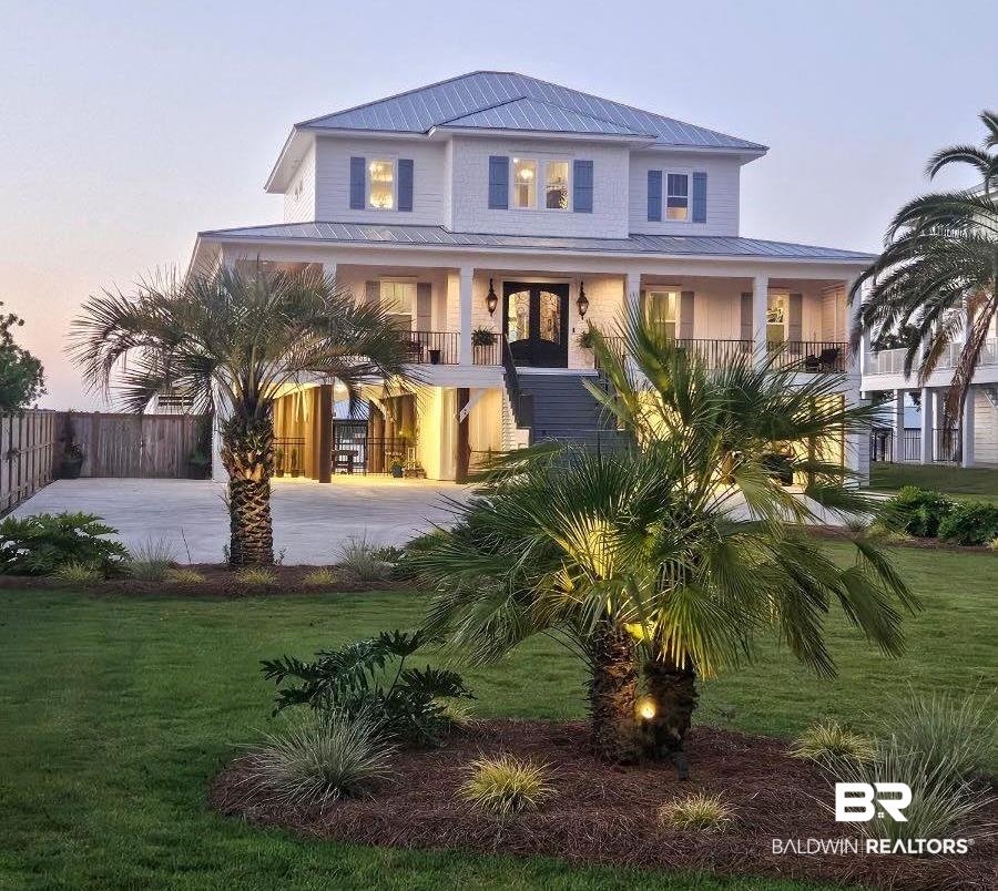 Presenting a stunning waterfront masterpiece by Bob Chatham Home Designs and custom built in 2023. This exceptional property is a true intercoastal gem in the sought-after community of Orange Beach, designed to maximize open water views and offer a luxurious yet inviting lifestyle tailored to modern needs. This Home boast over 7,600 sq.ft. total under roof areas, to include 514 sq.ft. climate controlled workshop and storage. From the moment you arrive, the southern coastal design and meticulous attention to detail will capture your senses and imagination. As you arrive at the home you will drive across the impressive custom installed driveway medallion compass pointing to true north and enter through the porches stunning cypress tongue and groove ceiling, then step inside through the impressive solid mahogany doors to an open floorplan with high 10-foot ceilings and water views from all living room, dining room and    MORE... SEE ATTACHED FULL "PUBLIC REMARKS" IN DOCUMENTS. Buyer to verify all information during due diligence.