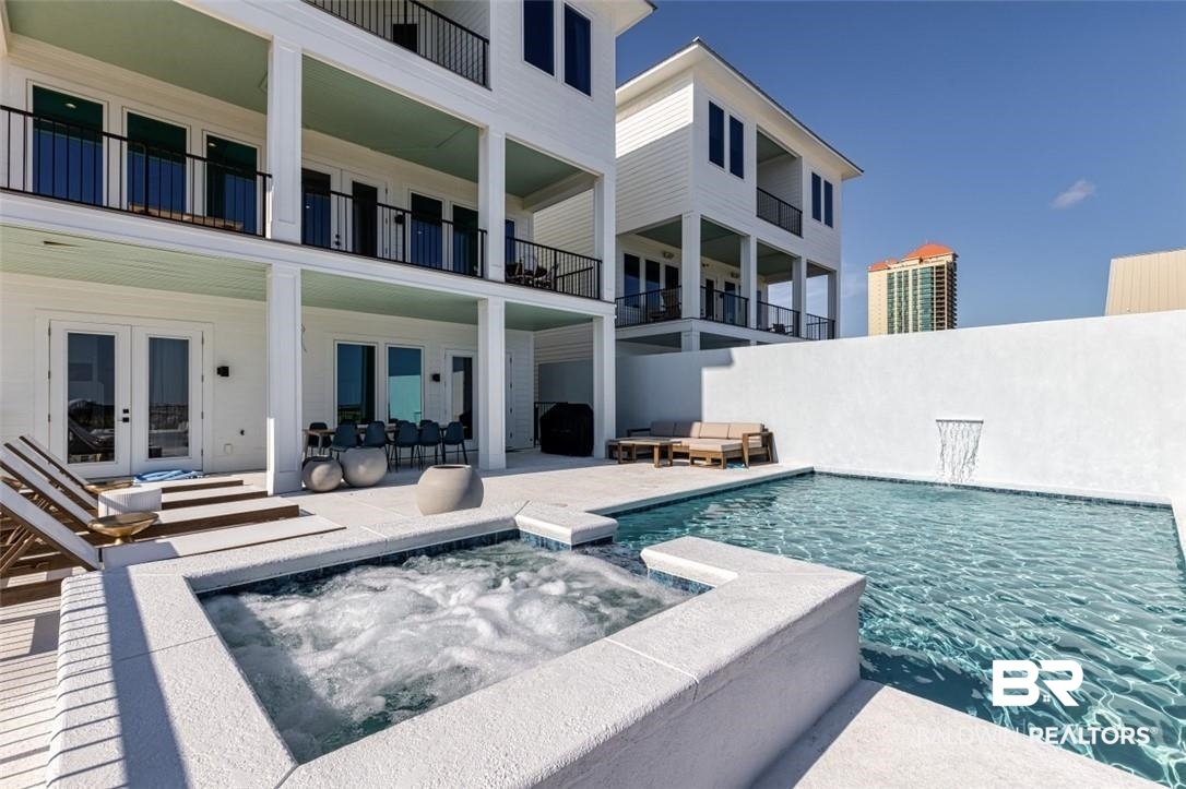 Stunning 7-Bedroom Beachfront Retreat with Private Pool. Outstanding Rental Revenue. Handicap accessible w/ elevator to every floor. Discover the epitome of luxury living in this magnificent 7-bedroom home, accommodating up to 18 guests. Custom-designed interiors and exquisite furnishings create an ambiance of elegance and comfort. Sold fully furnished, this property offers a seamless transition for new owners.Key Features: • Beachfront Paradise: Wake up to the soothing sound of waves and step directly onto the sandy shores. Your private beach awaits!        •      Handicap Accessible with Elevator • Private Pool: Lounge by the pool, basking in the sun or enjoying a refreshing swim. • Exceptional Rental Revenue: This home has intentionally maintained a strict pricing threshold and kept occupancy low to limit wear and tear and maintain quality. However, the rental revenue has been exceptional on the limited use.   • Proven Performance: Since its May 2022 debut, this home has grossed over $1.1 million in revenue. In 2023, even on minimal occupancy, it generated $356,681.15. Bookings for 2024 are already at an impressive $294,570. The total occupancy rate since May of 2022 has been 39.5%, but this home has been able to achieve an average daily rate of over 2,400 dollars a night since onboarding in May of 2022.  • Modern & Unique: Architecturally striking, this upscale home stands out as a one-of-a-kind gem. • Rare Location & Built-In Appreciation: This home is beachfront and condos cannot build near its location. That means this land and home will continue to appreciate due to it being in a very rare position on Perdido Beach BLVD.  • Management: The current management company, Unwind Luxury Vacations, agrees to continue management at a most competitive price. They have outperformed the market by more than double when directly compared across other management companies with similar homes. Please request more information. Don't miss this deal! This is an equitable inter