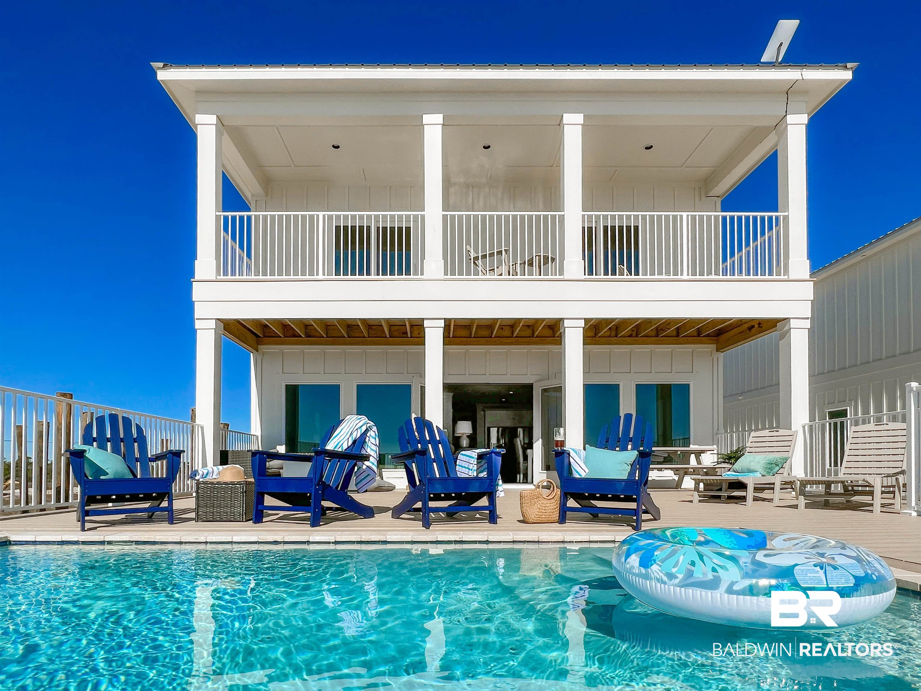 Around $40k on the books for SEPTEMBER ALONE and over $310k on the books so far this year! This is the house you've been waiting for - it checks all the boxes: Gulf Front, Gold Fortified, private pool and elevator! It also comes fully furnished and professionally decorated and will include the rights to stunning photographs taken by a well known and in demand vacation rental photographer, making this property completely turnkey and ready to start making money from day one. With 6 En-Suite bedrooms that can sleep 22 comfortably in beds, this house is perfectly set up for an amazing vacation experience. Stand-out features separate it from the competition, including: All six bedrooms are en-suite, sleeping 22 comfortably in beds; impact-rated windows/doors/foundation/roof which decrease insurance costs; located entirely north of CCL; gunite pool with gas heating in addition to electric, allowing full heat in the Winter; Outdoor kitchen with built-in gas grill (permanent gas line), refrigerator, and seating; professionally designed with high end furnishings and artwork; quality Polywood outdoor furniture on two large Gulf-facing decks; one showers is roll-in and accessible to wheelchairs; the elevator services all 3 levels. Don't miss your chance to own an almost-new gorgeous, beachfront home with lower expenses and great rental potential! Buyer to verify all information during due diligence.