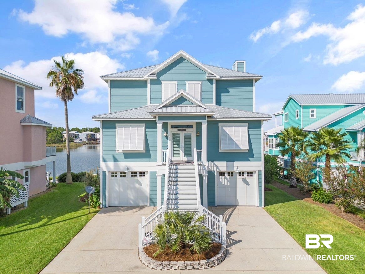 Welcome to Terry Cove Harbor and 26774 Martinique Dr, located on a DEEP-WATER harbor and close to the pass. This is a boater’s dream location that can provide dockage for a 70+ foot boat. The home was completely remodeled in 2019/2020 including the addition of a swimming pool. The home is approximately 3400 sq ft, has 3 bedrooms, 3 full bathrooms, an office and 2 half baths. The master suite is on the 3rd level with its own sitting and TV area along with the laundry room/second office and a guest bedroom. The second level features the kitchen, living room, dining room, guest bedroom, office and half bath. The kitchen features a 48” Wolf Oven, a 48” subzero refrigerator, wine cooler and microwave drawer. The wood floors on the second and third level are Bamboo. Both levels have large balconies with gorgeous views. The lower level features a family room, half bath and two storage closets. This area opens to the beautiful pool, covered sitting area and view of Terry Cove. You enter the garages from this level. One of the garages has a large storage room which is perfect for Christmas decorations, etc. Terry Cove Harbor Subdivision provides a secure private trailer/boat parking area and our own private boat launch. Buyer to verify all information during due diligence.