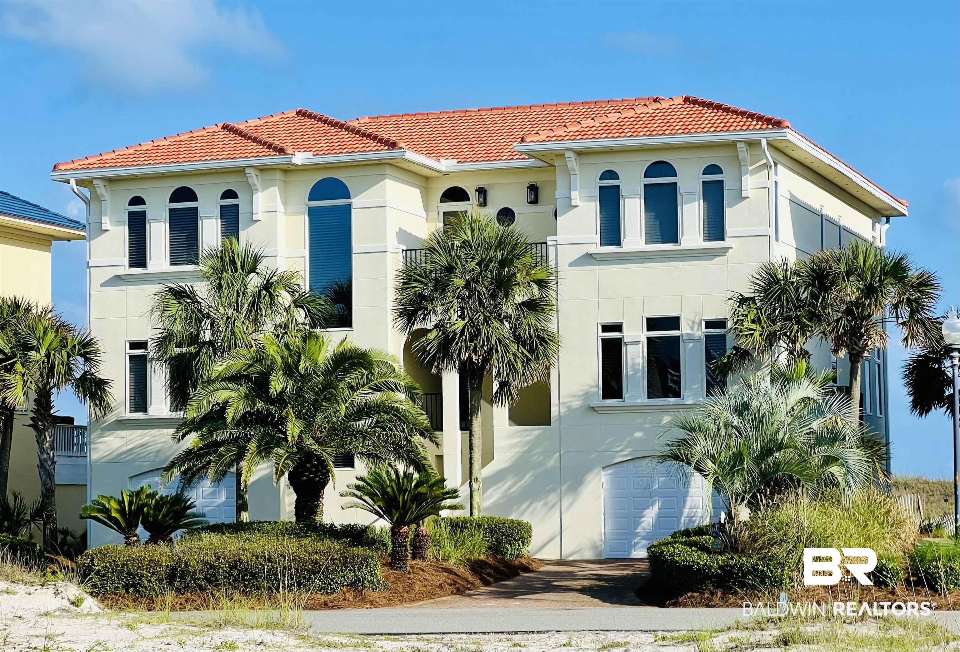 AMAZING PRICE AND GREAT RENTAL INCOME OPPORTUNITY FOR THE UPCOMING RENTAL SEASON! This luxurious 6-bedroom, 6.5-bathroom RARE GULF FRONT property features amazing views from every angle in the gated PRESTIGIOUS LAGUNA KEY SUBDIVISION! It's built on wood pilings with a 12-foot retaining wall with a thick vinyl bulkhead bolted inside the concrete slab! All bolted to pilings! This home boasts all-new stucco, paint, and window caulk (2022). Inside, discover new carpet in all the bedrooms (2022) and expansive family rooms on the second and third floors with large gulf-front balconies. The gourmet kitchen has a Sub-Zero refrigerator, standalone freezer, JennAir 6-burner electric stovetop with griddle, convection wall oven, microwave, two new dishwashers, and an ice machine. Upstairs and downstairs mini-bars include sinks, beverage coolers, and ice makers. There is a lockable owner pantry along with 2 guest pantries. The home offers six spacious bedrooms with private bathrooms, smart TVs, and ceiling fans. An elevator provides easy access from the garage to all floors, ensuring handicap accessibility. The property features impact-rated glass throughout. Beachside decks, renovated in 2024, are waterproofed and re-tiled, with turtle-friendly lighting (2022). Recent upgrades include a beautiful concrete tile roof (Eagle Tile, Malibu profile, Terracotta Gold) installed in 2022, rated as a 'Cool Roof' by California standards that is energy efficient. This home is fortified with a hurricane designation roof! Enjoy the large laundry room with commercial-grade washer and dryer (2020), whole-house water filter 2 remotely controlled Trane HVAC system with high SEER units, 2 new commercial grade water heaters w/ auto boosters, garage doors include MyQ app-enabled openers. Covered outdoor gas grill area, covered beachside patio with a dune walkover with foot wash, shower, bench, and steps down to the PRIVATE 75-FOOT WIDE BEACH. Additional info in Doc Tab! Buyer to verify all info.  B
