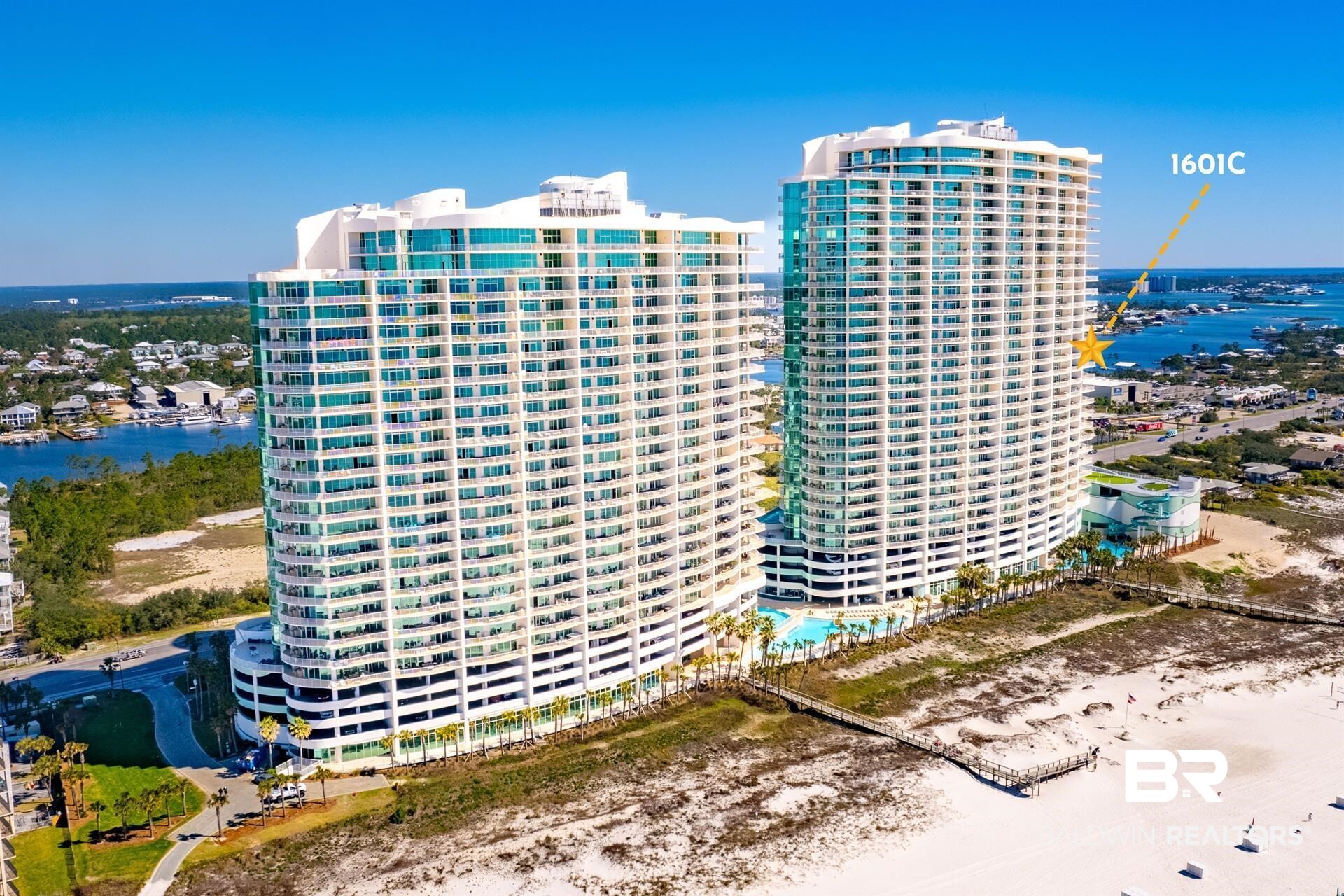 When only the best will do, you buy a corner unit on the Eastern side of C tower in Turquoise Place. This unit, C1601, is ideally located halfway up that exact stack. It's the only line in the Turquoise Place complex that has unobstructed views toward the Gulf of Mexico, Bird Island, Bayou Saint John, Wolf's Bay AND the pass (where boats enter and exit the bay)! This means you get dynamic views in all directions that change through the days, seasons and years. The views from these Eastern corner units are simply breathtaking. You need to see it for yourself to understand, as the pictures don't do it justice.  Everyone who has ever driven through Orange Beach can immediately see the difference between Turquoise Place and all the other buildings on the beach. It's truly in a class all its own. The current owners selected this unit based on the sightlines offered from the interior living space. They wanted to be able to see our sand as opposed to just blue gulf views. If you go much higher than this, you lose all views of the white sand our beaches are known for. They also wanted to make sure they were high enough to see the prominent water bodies clearly and be well above road noise and the parking garage next door. Imagine sitting outside with a cup of coffee watching the sunrise as boats of different shapes and sizes sail by. Showing by appointment only. Buyer to verify all information during due diligence.