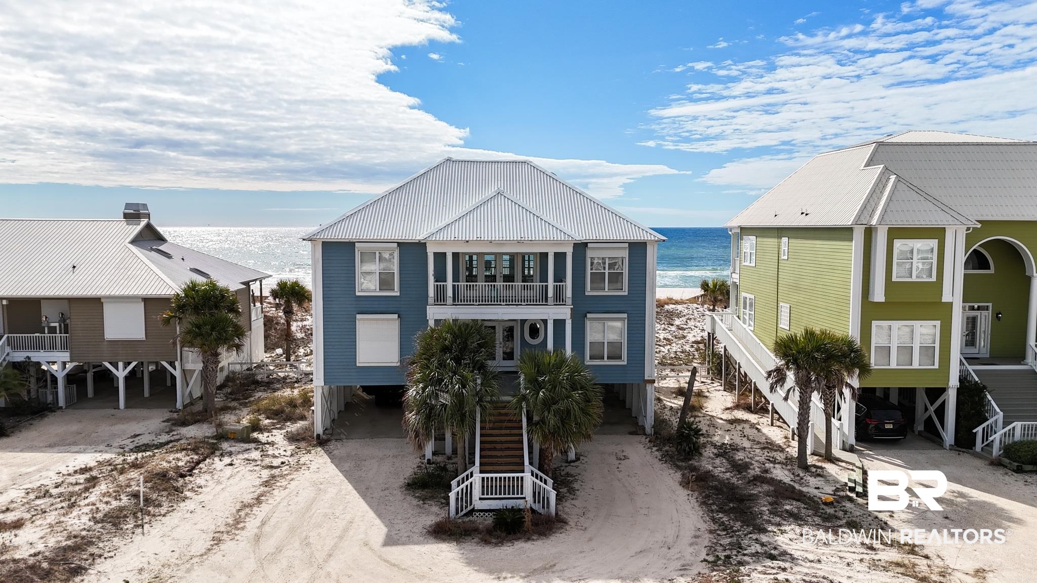 Calling all investors and dream home seekers! This exceptional 6-bedroom, 5-bathroom Gulf-front home in Morgantown is remarkable! Whether you’re seeking a lucrative investment or your own slice of paradise, this property is the ultimate coastal retreat. Boasting 75 feet of pristine Gulf frontage, this home offers breathtaking Southern exposure, highlighted by soaring 20-foot ceilings that fill the main and second-level living areas with natural light and stunning views. Designed for effortless entertaining, the open and spacious main living area easily accommodates larger groups and sleeps up to 20 guests. The chef’s kitchen is as functional as it is inviting, with ample storage and prep space—perfect for hosting while enjoying the Gulf views. Recent upgrades include a massive beachside deck and boardwalk, both rebuilt with durable Trex Composite, along with fresh paint and wood replacement underneath the deck. The main level features two bedrooms, including a Gulf-front suite and a bunk room with twin bunks and a queen bed. On the second level, you’ll find two Gulf-front bedrooms with direct access to a spacious, covered terrace offering unparalleled views, plus a bonus living area with balcony access. The home is equipped with electric storm shutters for added convenience and peace of mind. Additional amenities include two outdoor showers, a large storage room beneath the home, and plenty of parking. This home’s rental performance speaks for itself, making it a reliable income generator. Additionally, the Morgantown Community enhances the appeal with two outdoor pools and lighted tennis courts, providing endless entertainment for guests and residents alike. Whether you’re looking to expand your investment portfolio or settle into the Gulf-front lifestyle of your dreams, this home has it all. Schedule your private tour today and take the first step toward owning a piece of paradise!  Buyer to verify all information during due diligence.
