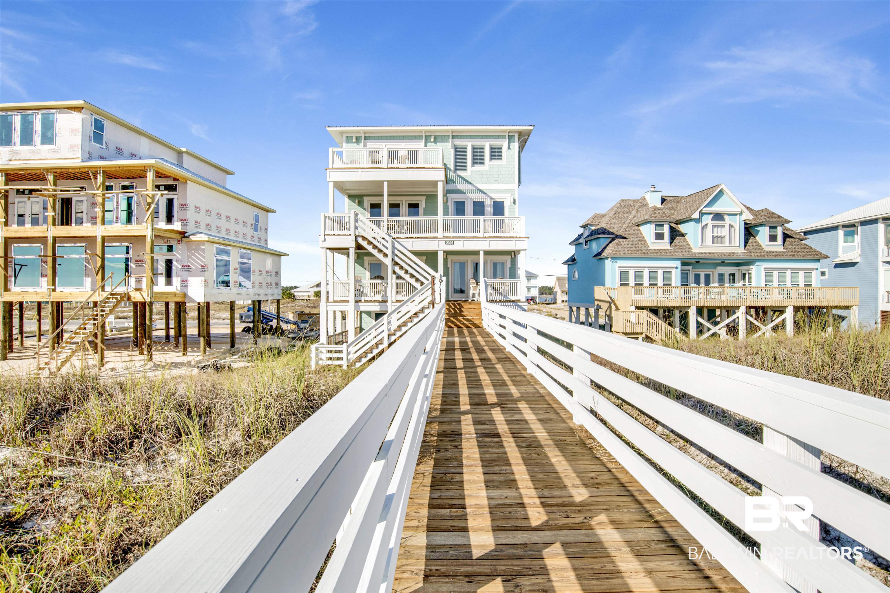 Welcome to beachfront luxury living at its finest! Incredible rental history and $250K in upgrades! Nestled on the shores of the Gulf of Mexico, Endless Summer is a spectacular 3-story residence boasting 7 bedrooms, 8 bathrooms, New Exterior Paint, New South Windows and doors, Incredible New Primary Bathroom and a host of upgraded features that redefine coastal elegance. This captivating home not only offers breathtaking ocean views but also provides the convenience of a private pool for the ultimate seaside retreat.  As you step inside, the first floor reveals a haven of comfort with four thoughtfully designed bedrooms, each completed with an en-suite bathroom providing a cozy and inviting space for rest and relaxation. The 1st floor primary bedroom features a recently remodeled handicap accessible bathroom. Moving up to the middle floor, an expansive living room, a stylish dining area, and a large gourmet kitchen create an open-concept space ideal for entertaining. With modern appliances, sleek finishes, and panoramic windows, this floor seamlessly blends functionality with the beauty of the surrounding landscape. A convenient laundry room and a full bath add to the practicality of this level. Ascend to the third floor, where three additional bedrooms await, including the opulent primary suite. Wake up to the sound of waves crashing and step out onto your private balcony to savor the breathtaking sunrise over the Gulf. The recently remodeled primary bathroom is complete with a double vanity, open walk-in shower, and garden tub with gorgeous Gulf views. All 3 floors have their own spacious balconies to soak in the sounds of the waves! A private elevator will conveniently transport you from the ground floor foyer all the way to the top! The outdoor space is an extension of the coastal paradise, with a private in-ground pool on the ground floor providing a refreshing oasis just steps away from the sandy shores. Buyer to verify all information during due diligence.