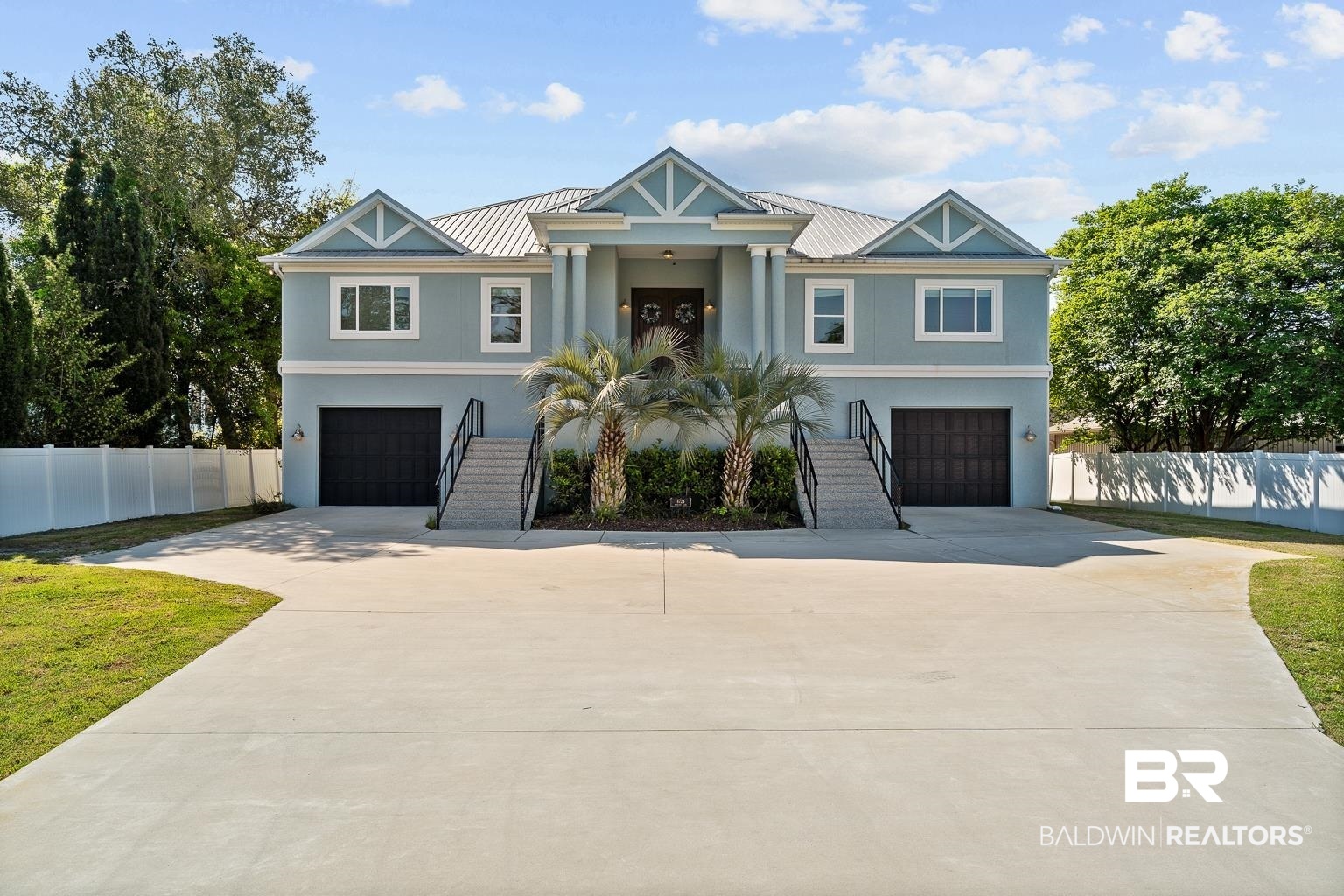 Situated in the highly desirable Burkart Estates on a protected deep-water canal, this commercial-grade concrete waterfront home offers exceptional craftsmanship, efficiency, and privacy (also sold partially furnished.) A gated entrance welcomes you onto the half-acre property, leading to a residence designed for both comfort and entertaining. The home features 5 bedrooms, 3 bathrooms, and an open-concept living space filled with natural light and water views. The main area includes a spacious den with custom built-ins for a 98" TV, an incredible dining room highlighted by Capiz Shell chandeliers, and a gourmet chefs kitchen with Omega cabinetry, granite countertops, wine and beverage coolers, an ice maker, trash compactor, oversized 66" refrigerator/freezer, and a 48" dual-fuel range. The primary suite offers a tranquil retreat with an amazing walk-in closet with tons of built-ins and a luxurious marble bathroom featuring an over-sized Kohler undermount jetted tub and incredible walk-through shower with rain shower heads. Currently two of the 5 bedrooms are set up as home offices. The canal view office has bookshelves as a Murphy bed for your additional guests. The home is equipped with geothermal HVAC, tankless water heater, LED lighting throughout, and is Gold Fortified for added durability. Annual insurance is attractively low at just $5,200. The entire lower level serves as a massive garage and workshop space, fitting at least 4-8 vehicles with direct access to the water. Outdoor living includes a 784 sqft open-air porch, a full outdoor kitchen and TV, and a 714 sqft boathouse with power, water, deep-water access, and an upper deck with Trex decking and seating for all the amazing sunsets! This one of a kind home is a rare opportunity offering high-end construction/finishes, privacy, and sunset views - just minutes from the Gulf and nearby islands. Please see doc tab for more property information!! Buyer to verify all information during due diligence.