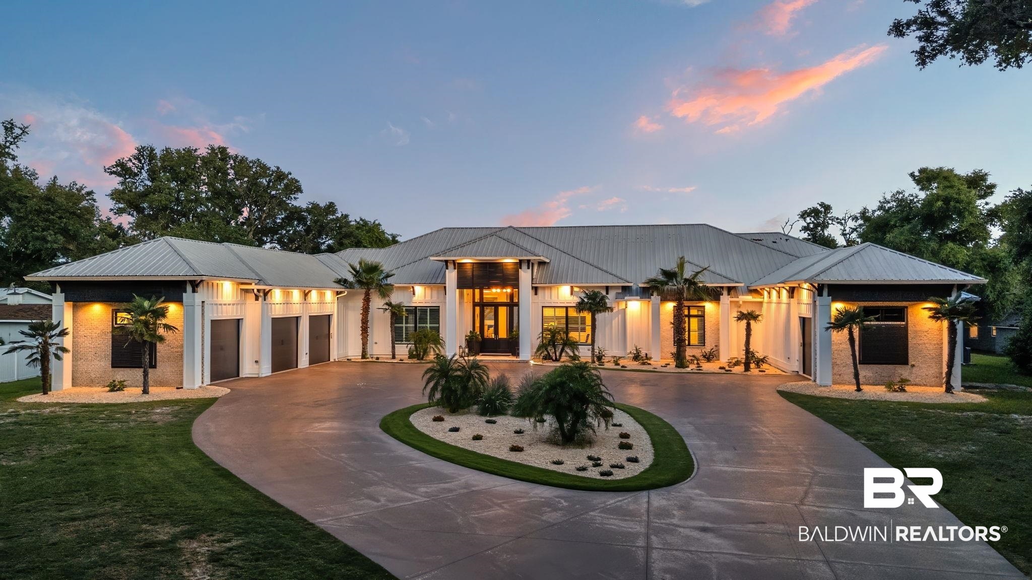 Where Luxury meets Legacy.   This 7BR/8BA + 2 half-bath waterfront estate is the epitome of coastal sophistication. Set on elevated ground with 190' of private beach and a 2021 dock upgrade that includes flow-through decking and has deep-water access, this smart home features a chef’s kitchen with Thermador appliances, his-and-hers offices, game room, 140 inch screen theater, safe room, and custom security system. In the heart of this exquisite home you will find the 1400 gallon custom built salt water aquarium. Enjoy a 9 foot deep, chilled and heated, saltwater pool, 10x10 spa, and full outdoor kitchen, all designed for flawless indoor-outdoor living. This is more than a home- it's a lifestyle. Every detail has been meticulously curated to offer a seamless blend of luxury, comfort and refinement, allowing you to fully relax and enjoy the essence of paradise. Built with enduring quality, this Chad Loper home upholds a standard of excellence designed to last for generations. Buyer to verify all information during due diligence.