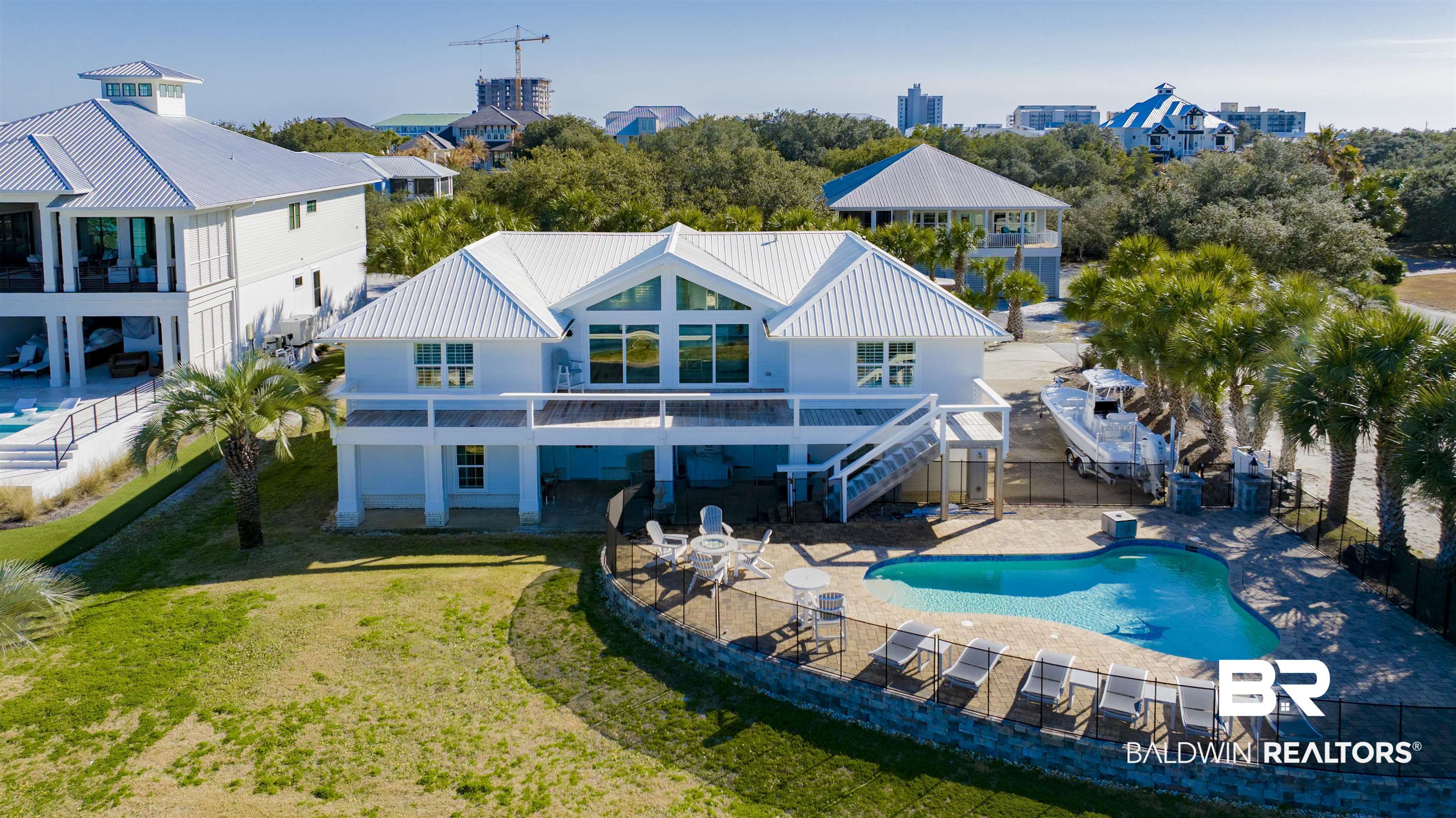 Location, Location, Location! This isn’t just a real estate saying—it’s reality!This stunning waterfront home offers privacy, unparalleled access to the Gulf for serious fishing enthusiasts, and a prime location near the entrance of the island. Enjoy the convenience of reaching the islands and waterfront restaurants by boat for a perfect day on the water.After a long day on the water come home and relax in the beautiful pool!Completely remodeled in 2014, more updating in 2022 this home sits directly on Bayou Saint John and boasts a Brazilian hardwood boat house with three boat lifts (16,000 lb., 19,000 lb. snd 27l lbs.)Don’t miss this opportunity to own a beautifully updated home in a premier location!  Buyer to verify all information during due diligence.
