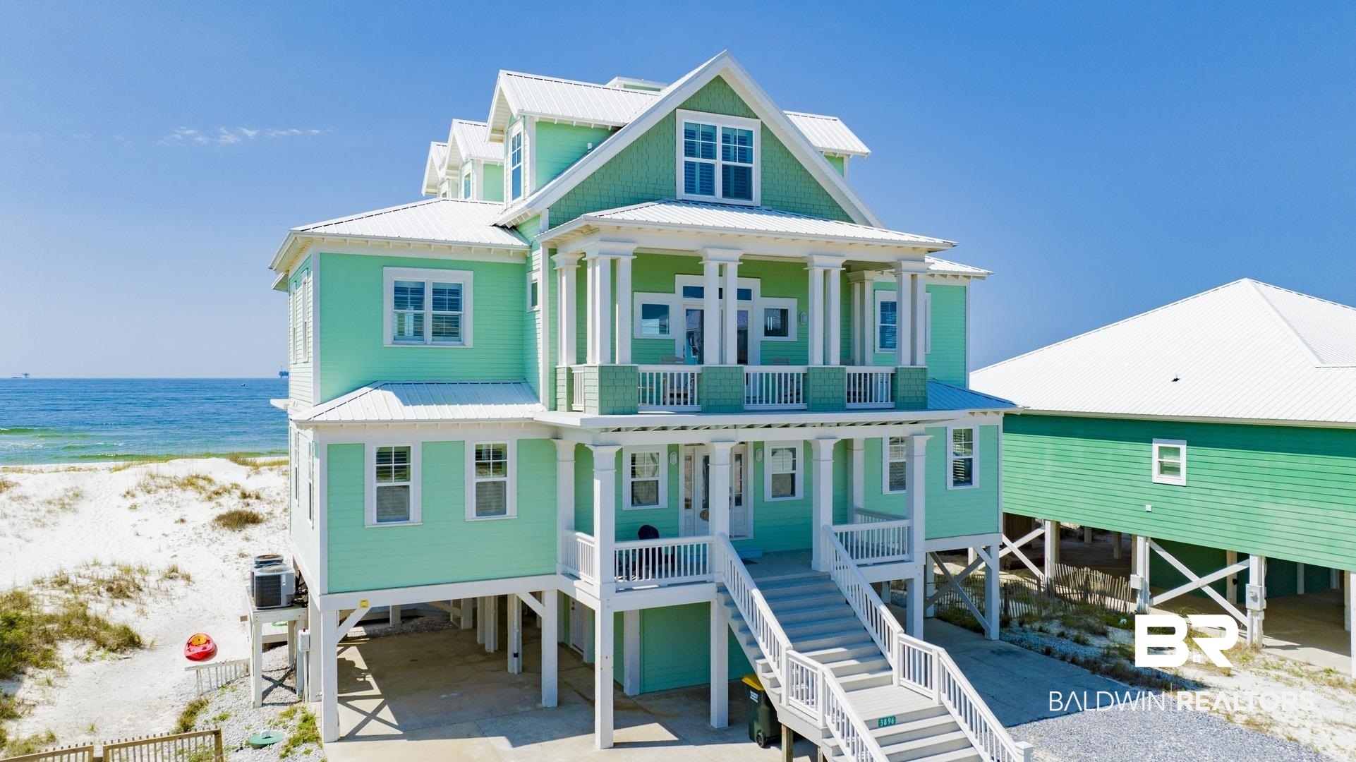Nestled along the pristine coastline, this stunning Gulf-front home offers a perfect blend of luxury and coastal living. With 6 spacious bedrooms and 6 beautifully appointed bathrooms, this residence boasts an exceptional layout designed for comfort and style. Every corner of the home showcases exquisite craftsmanship, from custom woodwork to intricate detailing, creating a truly elevated living experience. The open-concept living areas feature breathtaking panoramic views of the Gulf, filling the space with natural light and bringing the beauty of the beach indoors. The chef’s kitchen is a culinary dream, a large island, making it ideal for entertaining. Each bedroom is a serene retreat. The master suite offers a private oasis with sweeping views of the water, . Outdoor living is a breeze with multiple balconies, perfect for enjoying the sunset over the Gulf. The home has over 1500 square feet of covered deck.  This includes a large dine-on deck all the way across the beach side of the house, two private decks on the bedroom floor, a large bay-side deck, and a picnic/grilling deck at the slab level.  Hurricane-Impact Windows and FORTIFIED roof (2022)Whether you are looking to relax in luxury, entertain in style, or enjoy the unmatched beauty of the Gulf Coast, this home offers it all. A true masterpiece, designed for those who appreciate the finer things in life. Home sold furnished. Buyer to verify all information during due diligence.
