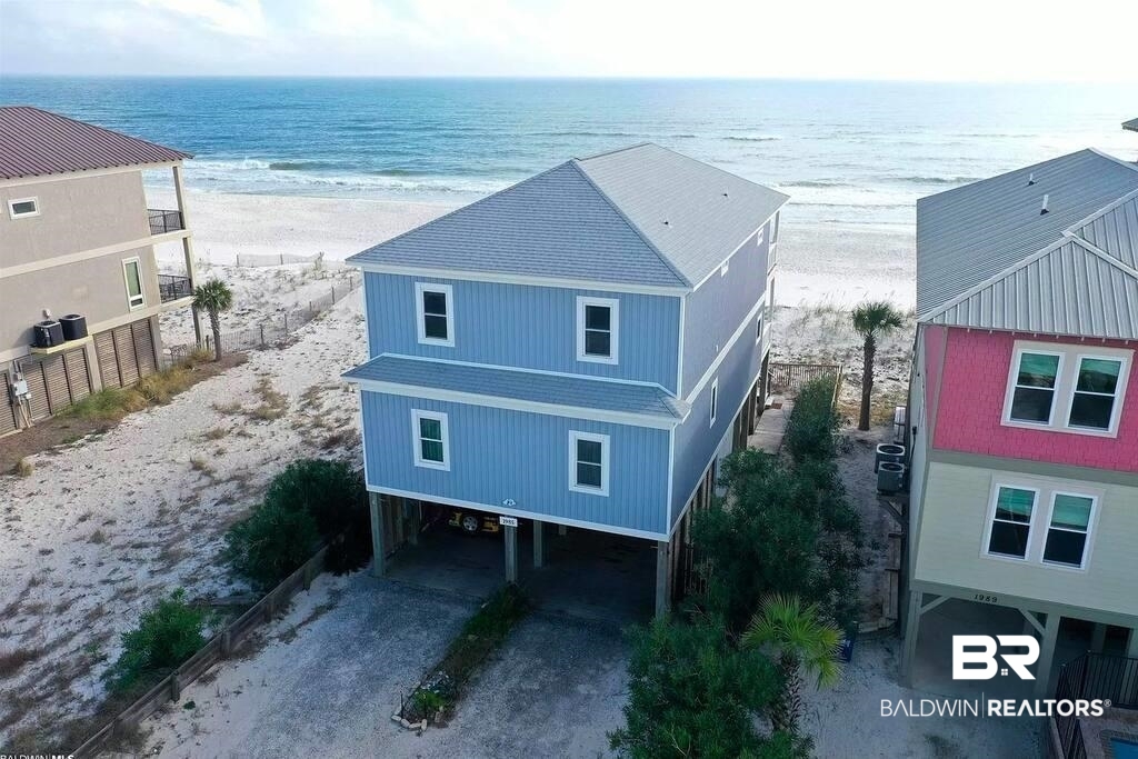 This is the Gulf front home you’ve been waiting for – whether you’re looking for an incredible investment property with proven numbers or a second home to create cherished memories with your family, this is the perfect beach house for you. This property is completely turnkey. In addition, the owner is willing to stay on as a host for a reasonable fee to make this seamless in the transition of ownership if the new owner desires. Recent upgrades include – new hot water heater, custom Tiki Bar, all new décor, new 6 burner commercial stovetop/oven, new dishwasher, new dryer, new mini fridge for the Tiki Bar, new outdoor storage closet, new refrigerator, all new decking, custom surfboard outdoor shower, new HVAC deck, new carport flooring, all new lighting in the living room/kitchen, all new fans, new hurricane strapping, new hurricane strapping replaced with stainless steel strapping, new stainless steel bolts, and more! There is a bunk room in addtion to the 5 bedrooms and is listed as a 6br on Airbnb. The downstairs Tiki Bar area is an incredible hang out spot for friends and family and a huge hit with renters. Don’t miss your chance and schedule a showing today! Rental history available upon request. Buyer to verify all information during due diligence.