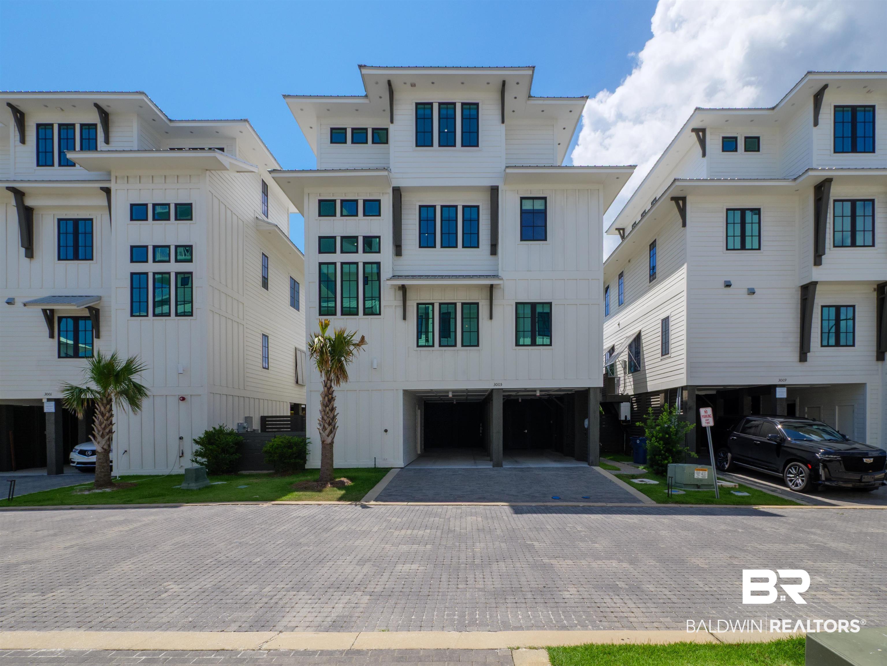 Beachside Luxury in The Bluffs at Orange Beach!  This amazing 4BR/4BA/2HB home beautifully furnished by locally renowned Melanie Martin Interiors offers the perfect blend of coastal elegance and comfort. Never rented and immaculately maintained, it’s ideal as a second home or investment property with a 3-night rental minimum allowed.  An elevator provides access to all 4 levels. The ground level features a private pool, grilling area, outdoor shower, cabana lounge with TV, and a half bath. On the main level, enjoy a chef’s kitchen with Wolf range, Sub-Zero fridge, quartz counters, prep island, wet bar with wine fridge and ice maker, and a half bath. Custom cabinetry extends to the ceiling.  The third floor offers a cozy living area and three en-suite bedrooms plus a laundry room. The fourth-floor primary suite features Gulf views and a peaceful retreat. Each level has access to a private balcony.  Built by Phil Harris Construction, this Gold Fortified home includes high-impact windows and doors. Located in the heart of downtown Orange Beach, you’re within walking distance to restaurants, shopping, and grocery stores. Bike trails are nearby, and you’re just steps away from a private gated boardwalk to the beach.  Don’t miss this rare opportunity to own in The Bluffs at Orange Beach. Buyer to verify all information during due diligence.
