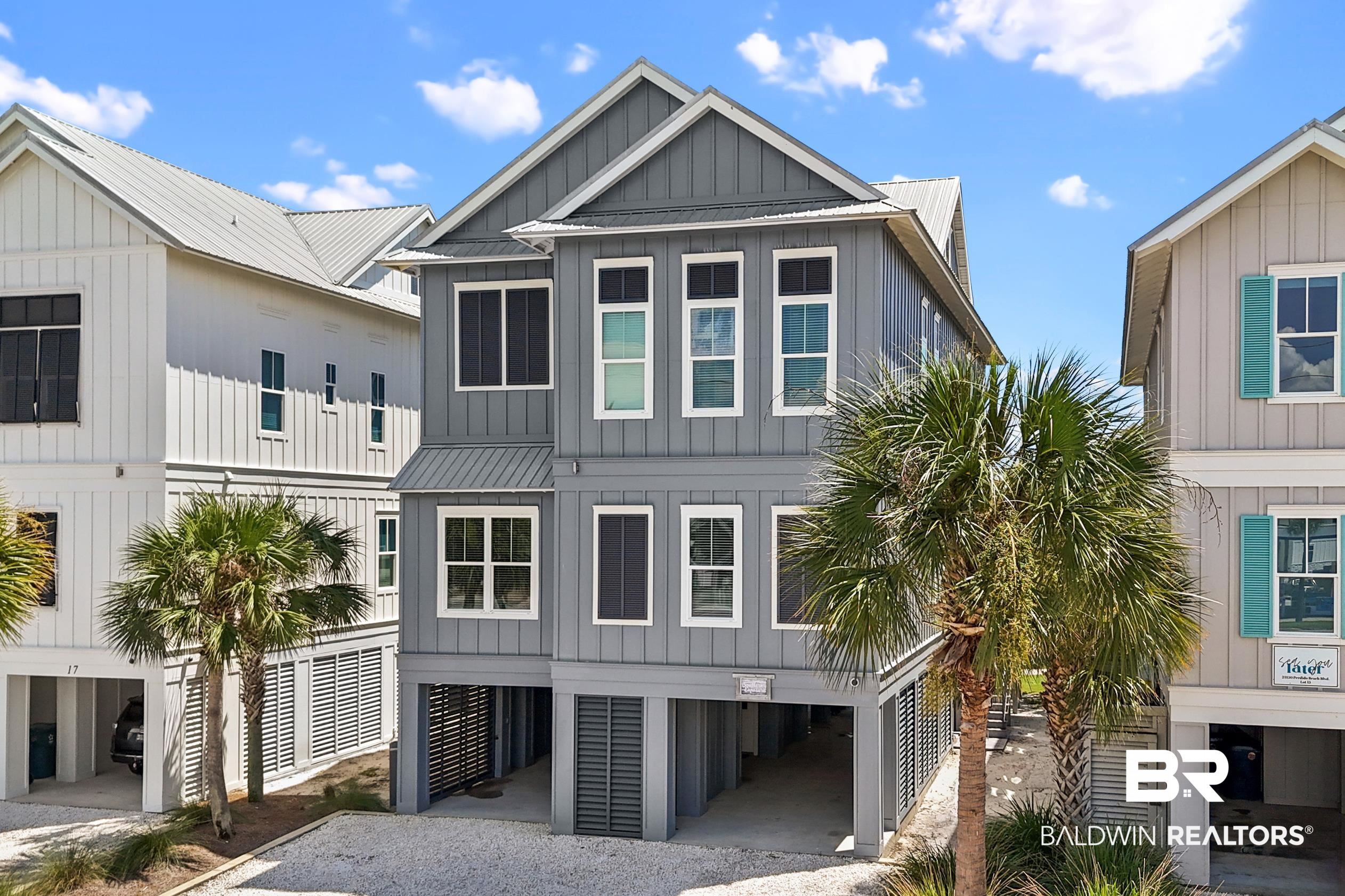 Welcome to “Southern Exposure” in the popular beachfront community of Cottages at Romar in beautiful Orange Beach. This stunning south-facing, poolside retreat boasts 7 bedrooms, 7.5 bathrooms, and sleeps up to 24, making it ideal for vacation rentals or large groups. This Fortified Gold home features living areas on each floor, a well-appointed kitchen with stainless appliances and ample dining space, coastal-inspired interiors, wood walls and ceilings, custom tiled showers, a private elevator, multiple balconies with Gulf views, an outdoor shower, and private deeded beach access just steps away.  The community resort-style pool is right outside the back door.  This home is just minutes from top restaurants in Gulf Shores and Orange Beach, shopping, fishing, and entertainment — yet tucked into a private, gated Gulf front community for peace and relaxation. Fully stocked, furnished, and move-in ready. Buyer to verify all information during due diligence.