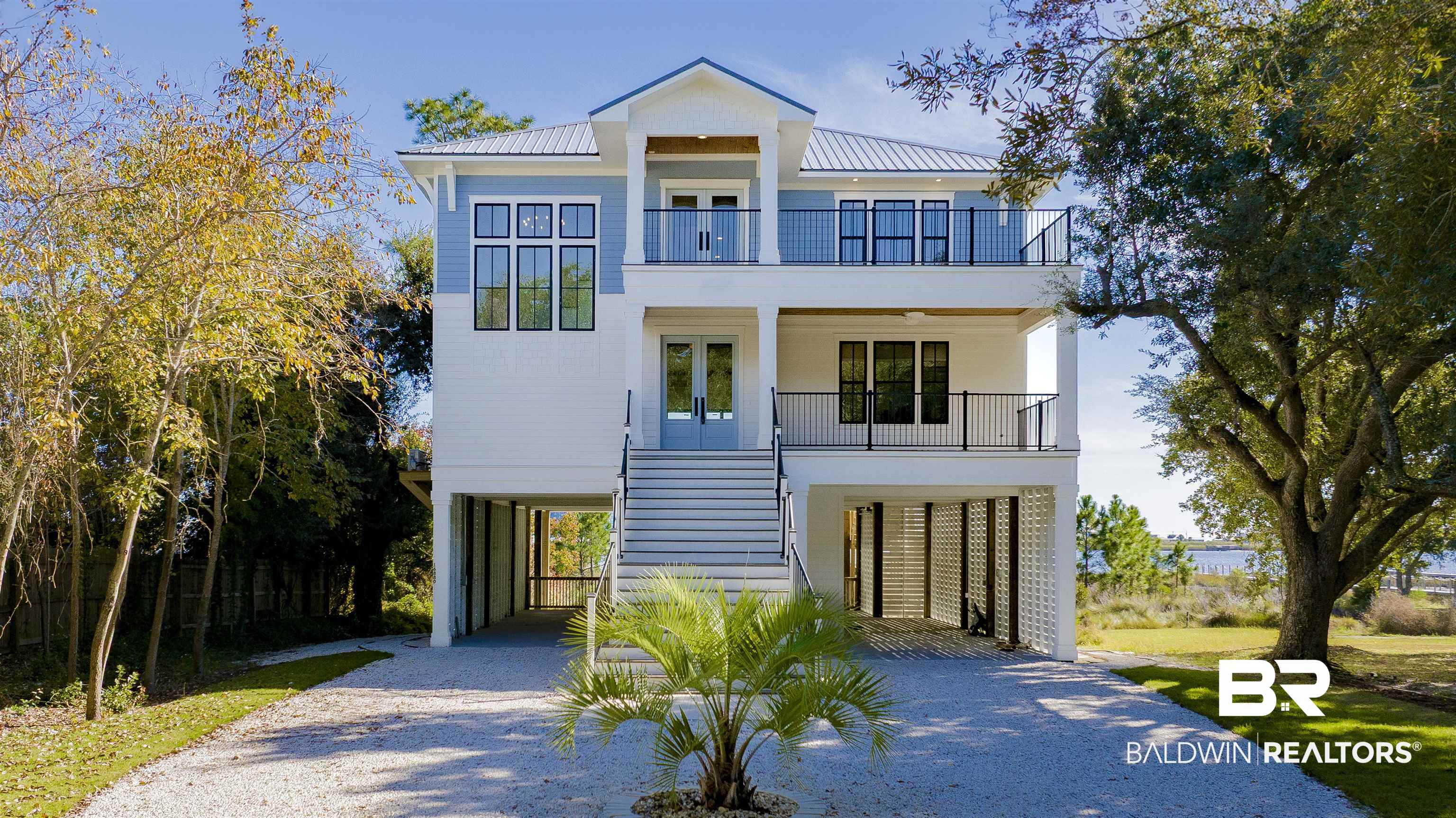Welcome to Legacy House on The Lagoon. This BRAND NEW, CUSTOM BUILT, NEW CONSTRUCTION ESTATE is where timeless design meets tranquil coastal living. Every detail of this Gold Fortified property was thoughtfully crafted from the gracefully curved “little black dress” driveway with a coastal flair to the stately staircase made for life’s most iconic moments. This 5 bed, 4 bath, 2 half bath retreat captures sweeping views from the Lagoon to the Gulf. Start each morning with coffee and quiet reflection as the sun rises, and end your day in the sunroom as the sky glows across the water at sunset. Spend afternoons boating, kayaking, or fishing from your private boathouse. The open main level features a chef’s kitchen with waterfall island, dining area, fireplace / cocktail lounge, and expansive deck for effortless entertaining. With over 1,600 sq ft of outdoor living across four decks, Hardie exteriors, TREX decking, and elevator access throughout, every moment becomes a carefully curated experience. Legacy House on The Lagoon is a modern coastal masterpiece built to be cherished for generations to come. Buyer to verify all information during due diligence.