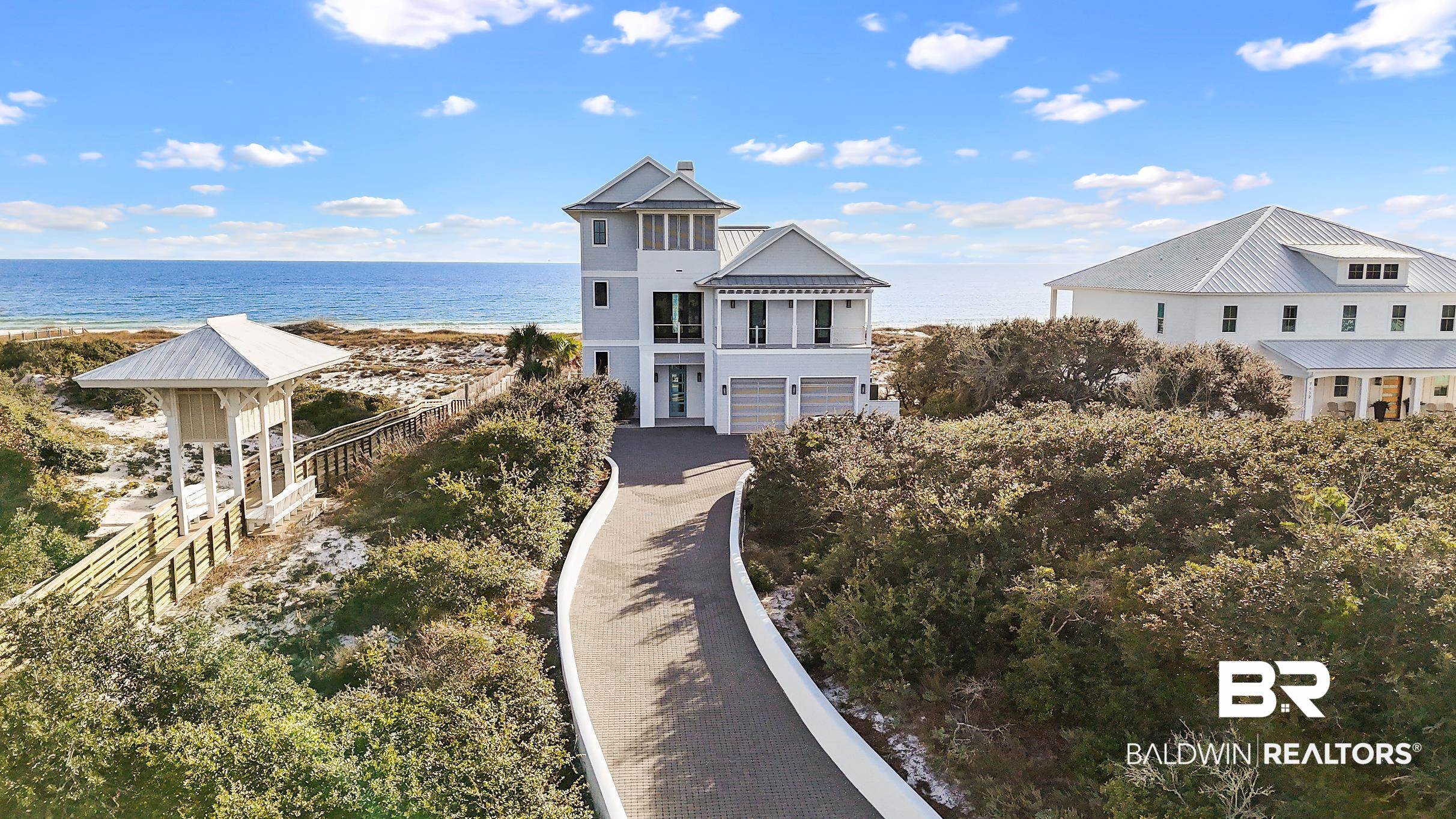Kiva Dunes Gulf Front Home Turn Key and sold Fully Furnished. Dare to compare any other Gulf Front homes on the Gulf Coast.  This remarkable Craftsman Cottage Designed by architect Sted McCollough and built by Denny Blume has far to many features to list all of them here but include: Brick Paved gated entry with retaining wall surrounded by amazing native landscape, Double Garage with louvered doors, direct 1st floor entrance to main living area with Lot elevations 20 feet above sea level in Flood Zone X, No Flood insurance required, main level open floor plan with hardwood floors throughout, beamed high ceilings, surround sound, antique brass lighting, large kitchen with island, Thermador 6 burner gas cooktop range with flat top option - double convection oven, Sub Zero Fridge and Freezer and large walk in pantry with built in shelving and draws. This main level living is a Sea of Light with multiple large doors and windows leading to massive open gulf deck with over 2000 square feet of lounging area to enjoy the sun and beautiful pool. Also an additional covered gulf facing balcony which includes built in outside grilling station. 2nd level has 3 gulf facing guest rooms with full baths, bunk room with full bath, media room with TV and sound bar plus covered balcony.  The entire 3rd floor master suite floats over the Gulf with large bedroom and seating area, master bath with soaking tub and walk in shower with multiple shower heads, double vanities and walk in closed with built in wood shelving. There's also a large covered Golf Course facing deck.  Many other features to this brilliant home. The different custom crafted lighting throughout the home will truly amaze. Home includes a private elevator, 2 different laundry rooms, multiple owners closets and more. Established rental income with Kiva Dunes Properties " The Salty Sol " is a gulf front home not to be missed. Find your Kiva today and begin enjoying a lifestyle unrivaled on our Gulf Coast.  Buyer to verify