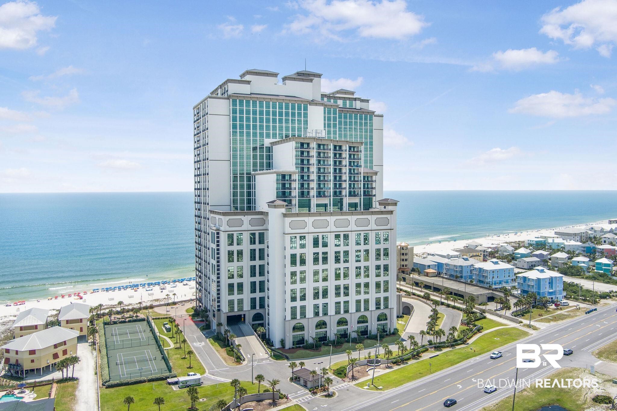 ELECTRIC BLINDS on all West side windows! This 4 bedroom/4.5 bathroom condo is is nicely decorated with coastal decor and a MUST SEE! Watch the sunset on the spacious private balcony with panoramic views of the Gulf. Stainless steel appliances, tile throughout.  IF you want the BEST condo in Orange Beach...here's your chance. The Oasis (formally Phoenix West II) is located on the exquisite white sand beaches of Orange Beach with many amenities;Gulf front lazy river, indoor/outdoor pools, adult only pool, poolside walk up bar & cafe, kids splash pad, hot tubs, fitness center (2 floors) tennis court, garage parking for everyone, grilling area & MORE! Security 24/7.  Near state park, shopping, restaurants, fishing and family fun. Some items do not convey. On rental program. Pictures coming soon. Buyer to verify all information during due diligence.